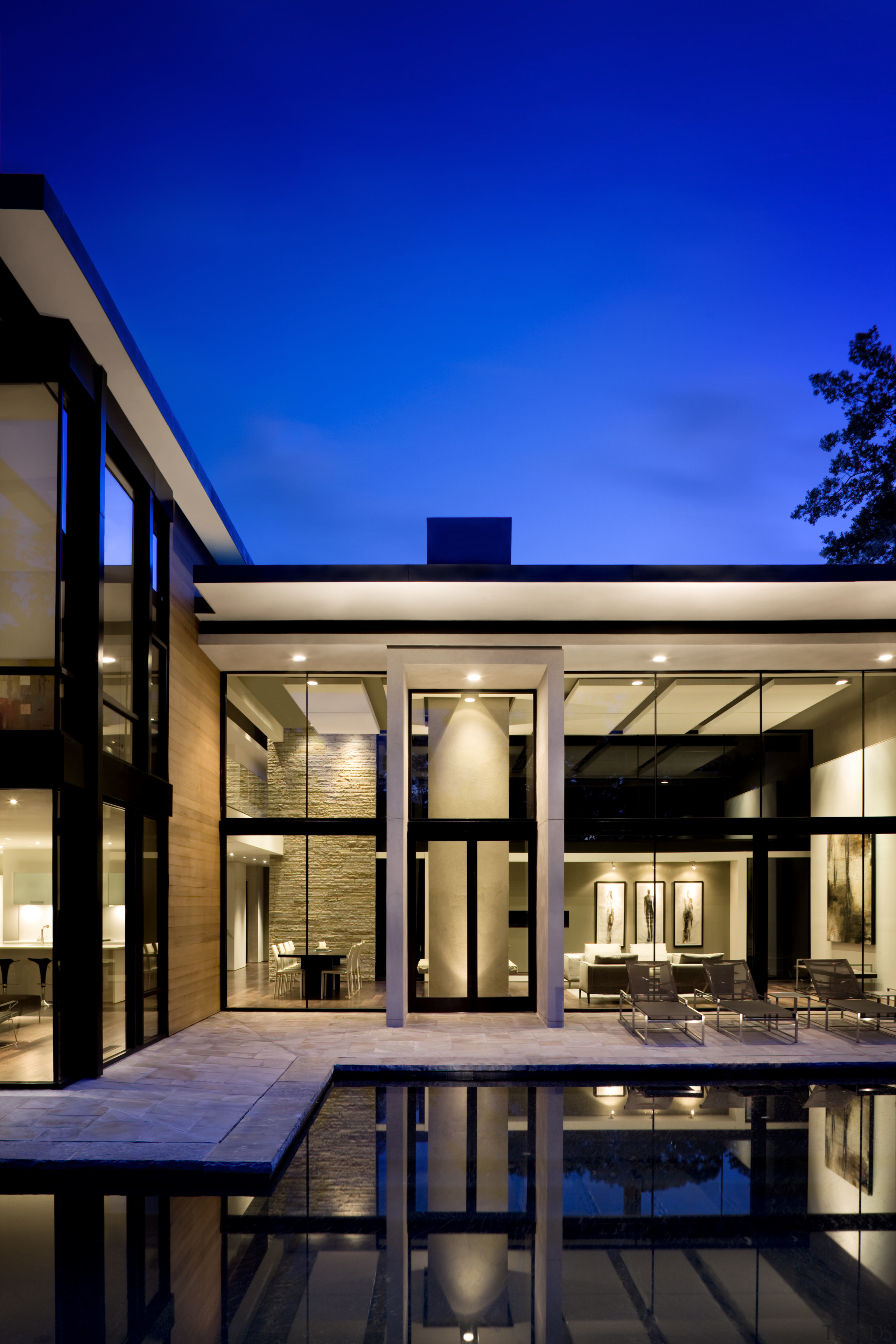 View of the exterior featuring a range of architecture, daylighting, estate, facade, home, house, interior design, lighting, real estate, residential area, sky, window, blue, black