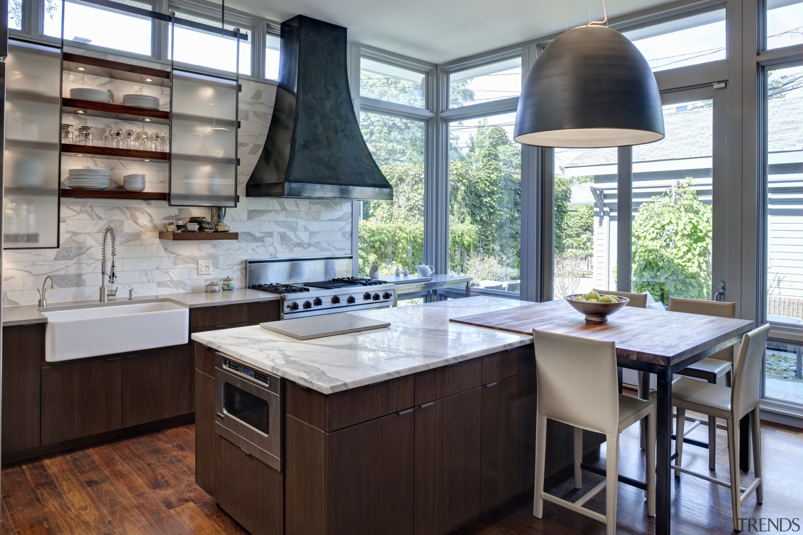 Bar stools provide a place for family and cabinetry, countertop, cuisine classique, interior design, kitchen, gray