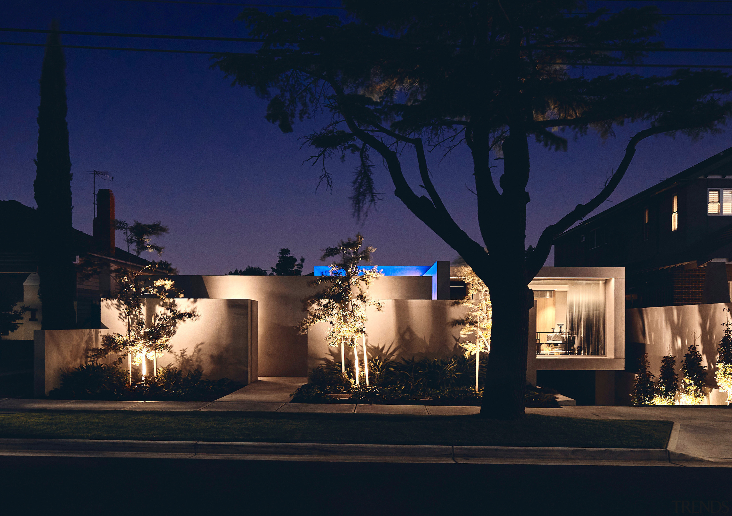 Night lighting accentuates both plantings and the strong 