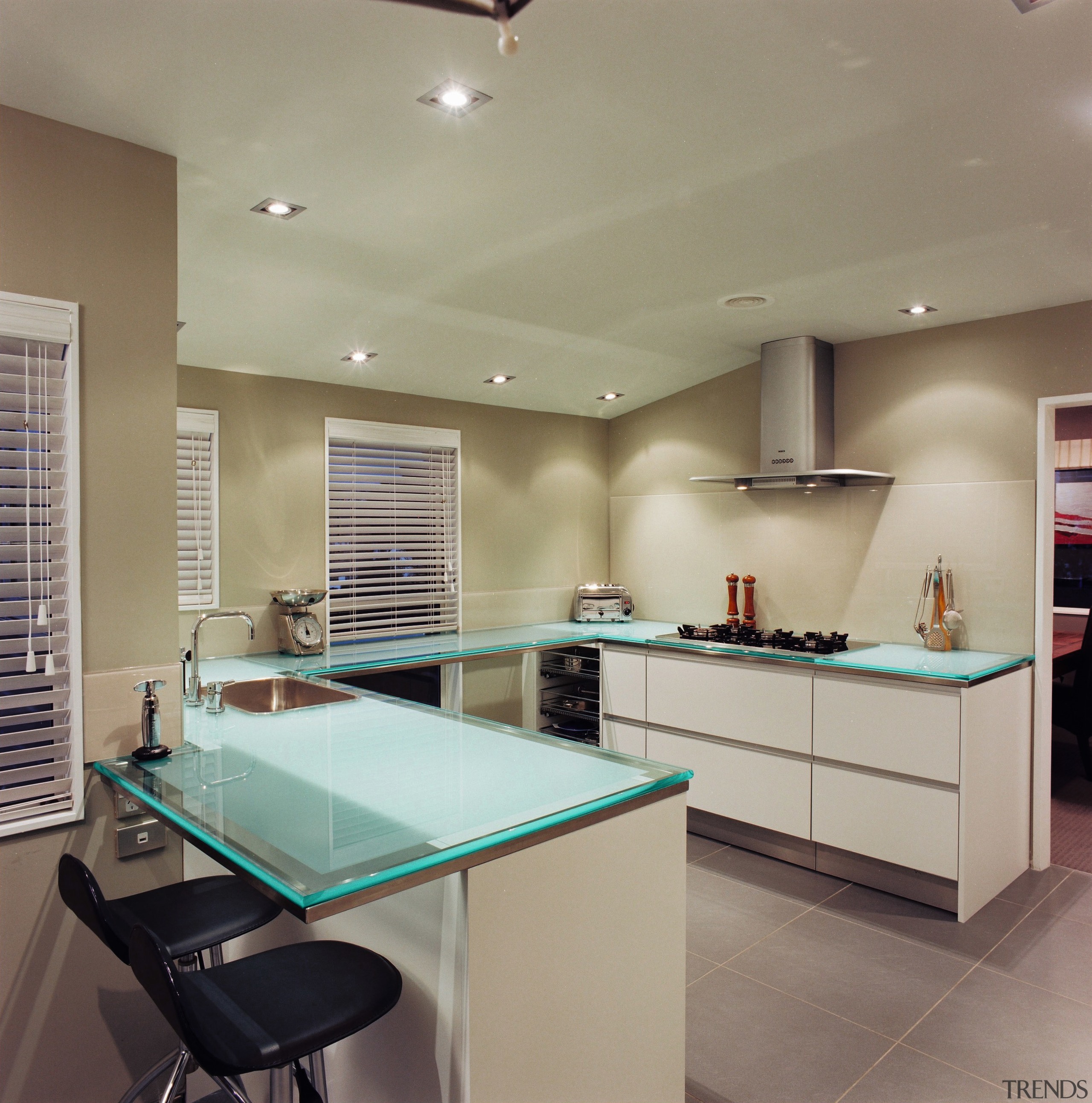 Hansen designed and manufactured this kitchen using glass ceiling, countertop, interior design, kitchen, lighting, real estate, room, gray