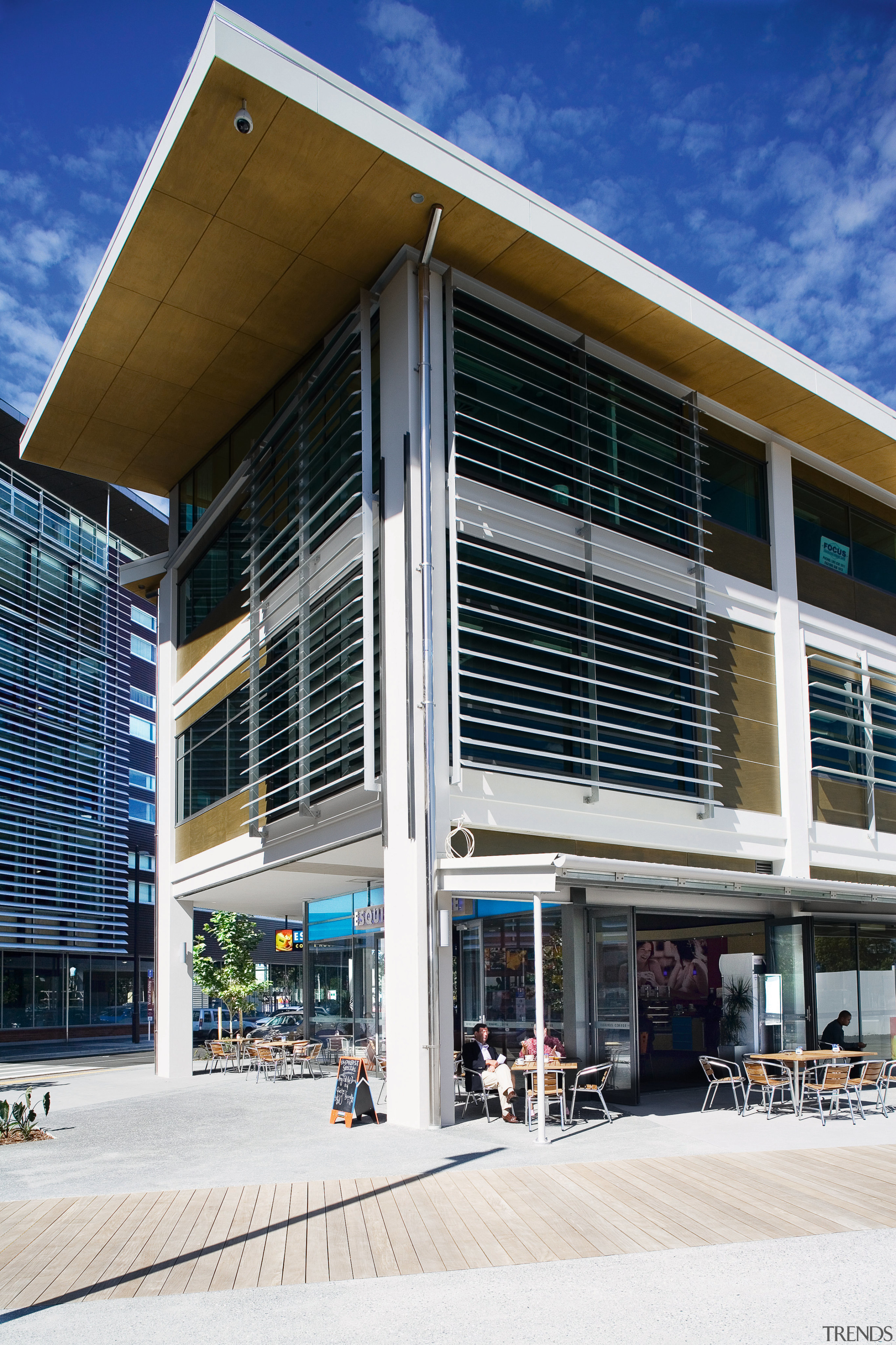 A view of extensive use of elliptical louvres architecture, building, commercial building, corporate headquarters, facade, mixed use, real estate, window, white