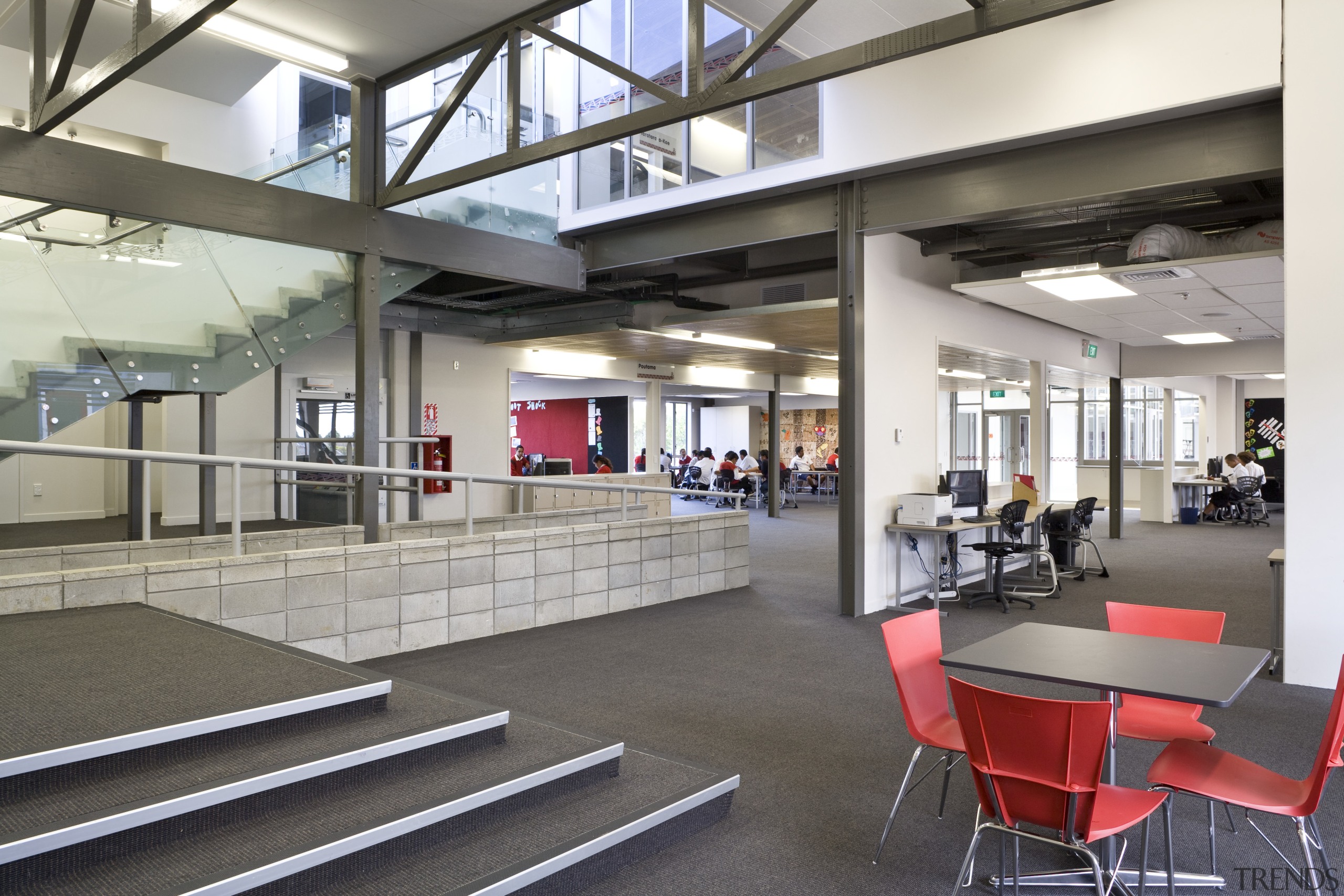 View of open-plan working area which features furniture, institution, interior design, lobby, gray