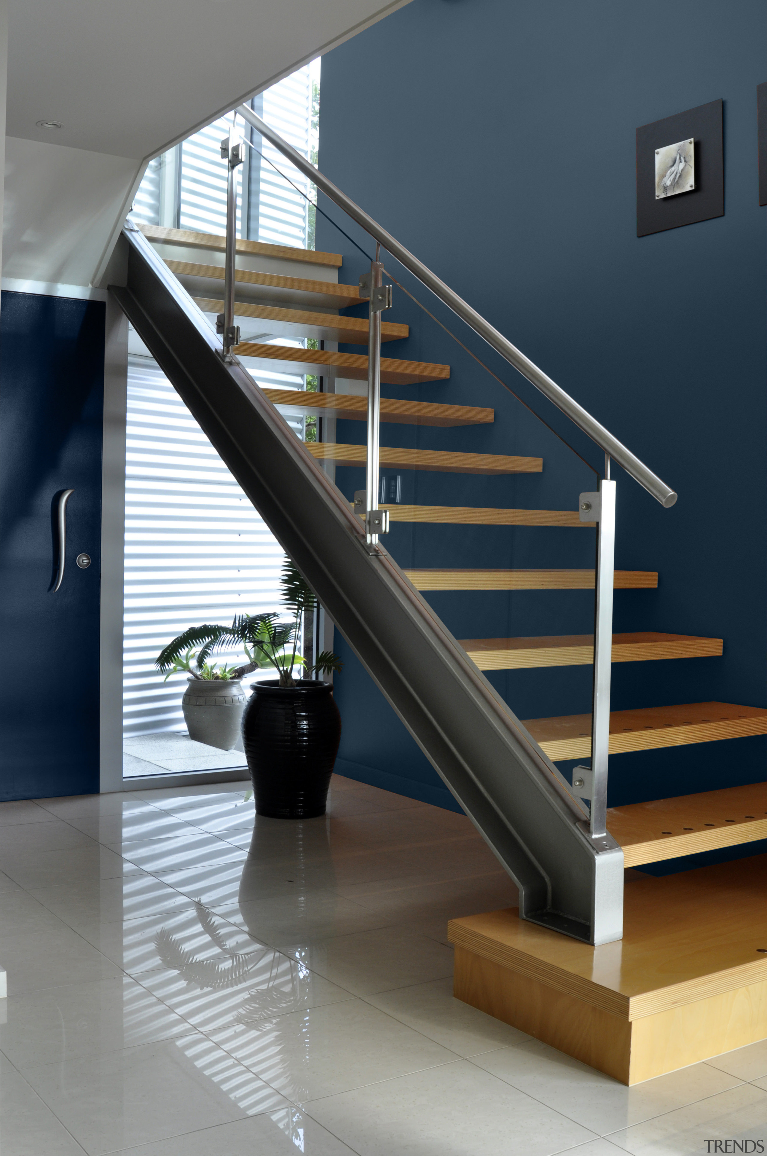 View of the stairway which features paint from baluster, glass, handrail, interior design, product design, stairs, structure, gray