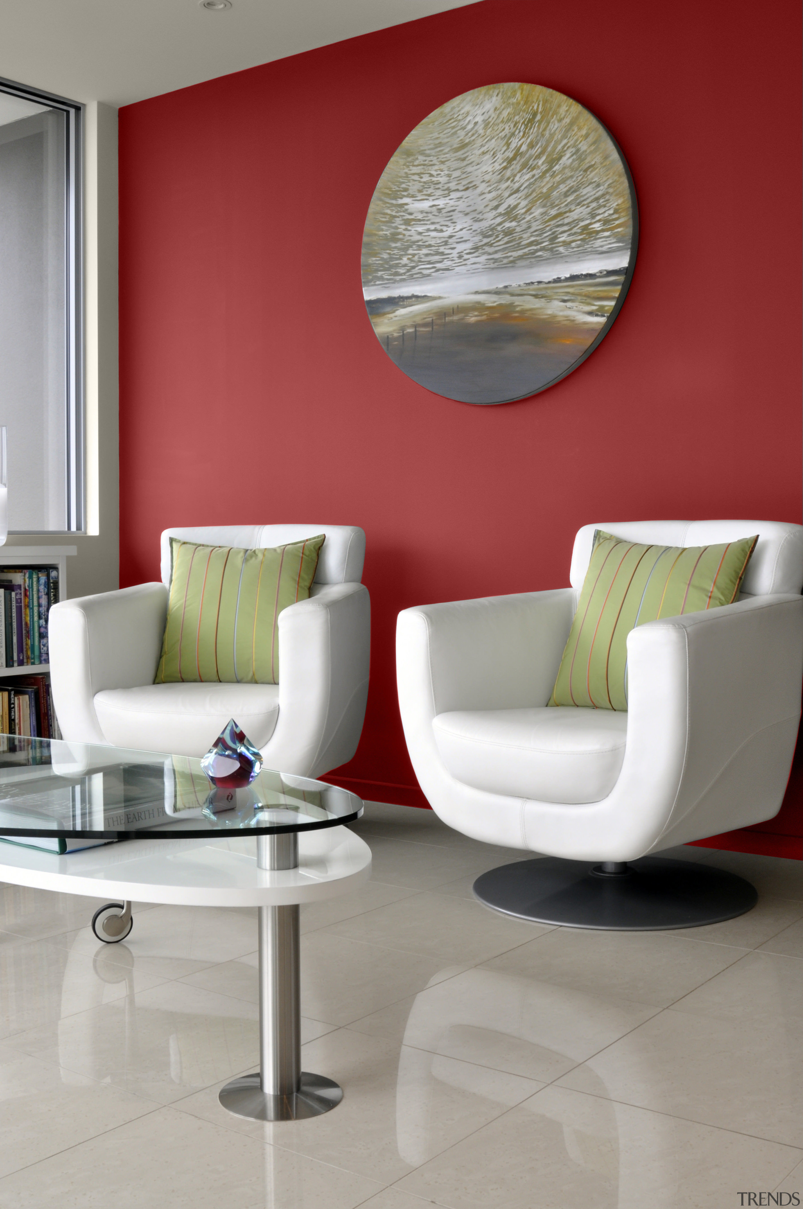 View of different coloured feature walls behind a chair, coffee table, floor, furniture, interior design, living room, product design, table, wall, gray, red