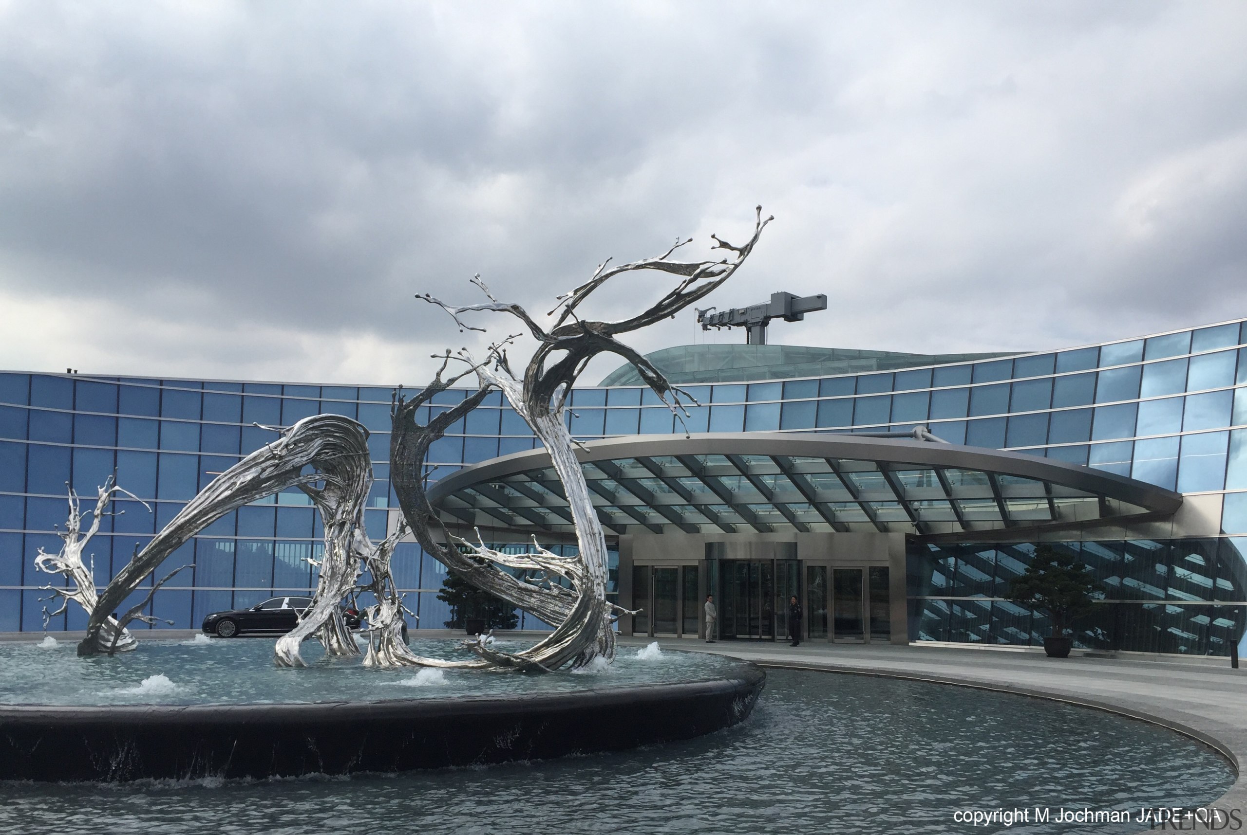 Sculpture in front of the entrance lobby at architecture, art, fountain, sculpture, water, water feature, white