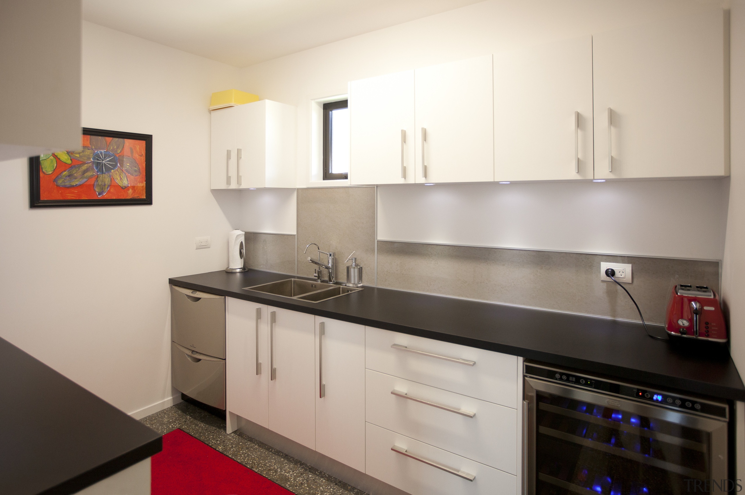 Kitchen with white cupboards, black benchtop and red cabinetry, countertop, home appliance, interior design, kitchen, property, real estate, room, gray
