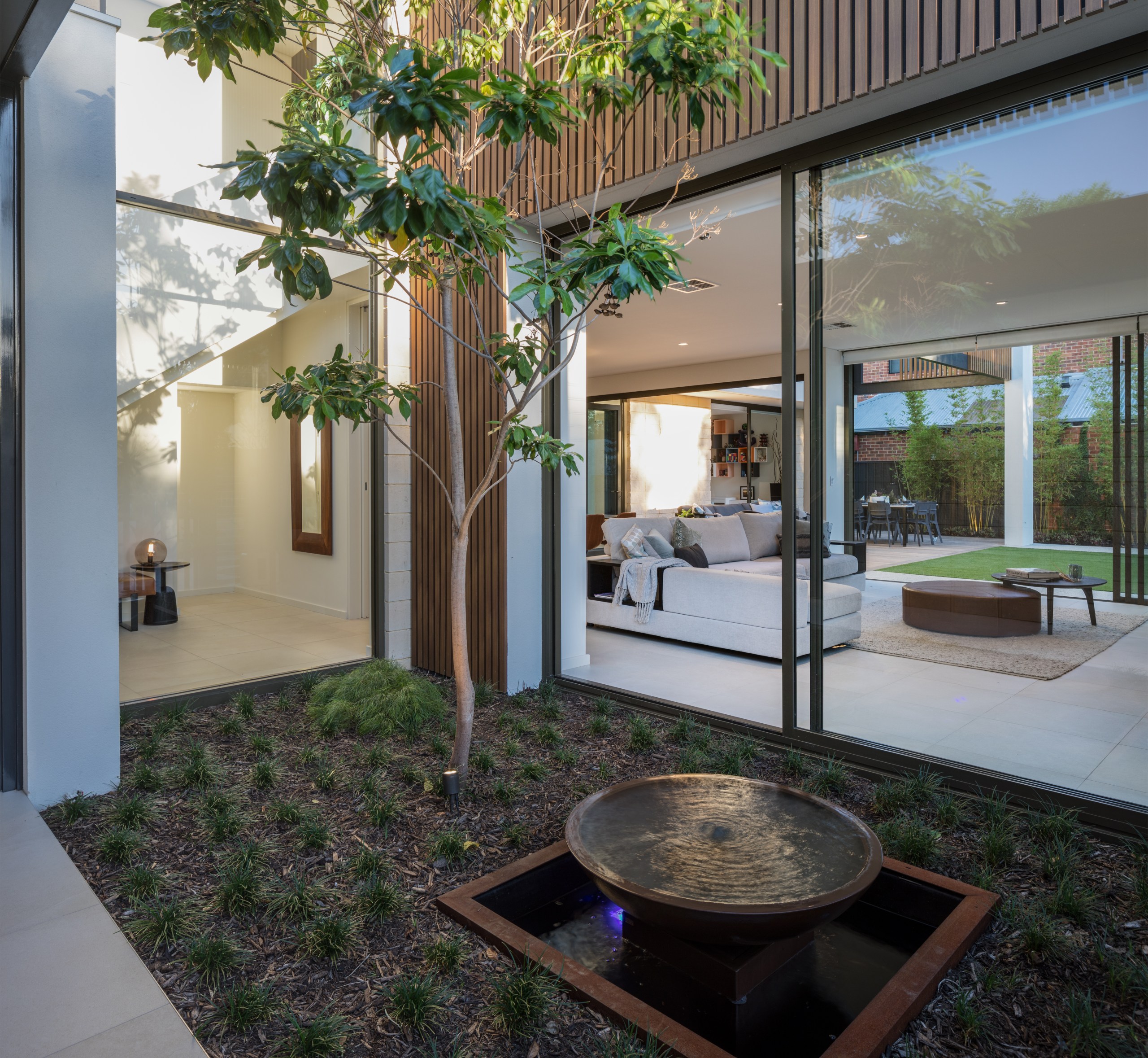 ​​​​​​​Transparent agenda – approaching the front door, visitors apartment, architecture, backyard, building, courtyard, floor, furniture, home, house, interior design, plant, property, real estate, room, table, tree, gray, black