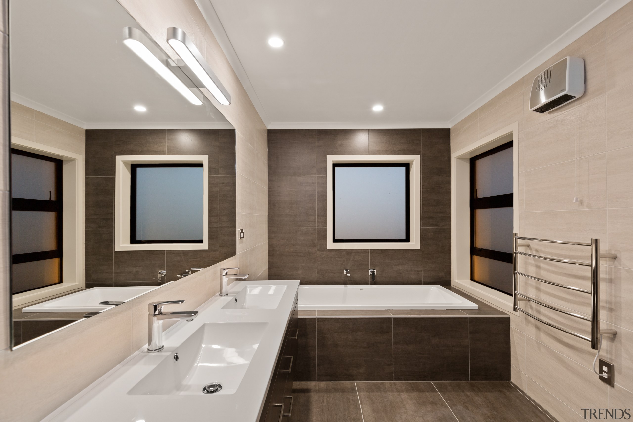 ​​​​​​​Natural tones and refined surfaces are features of architecture, bathroom, bathtub, building, ceiling, floor, furniture, home, house, interior design, plumbing fixture, property, real estate, room, sink, tap, tile, gray