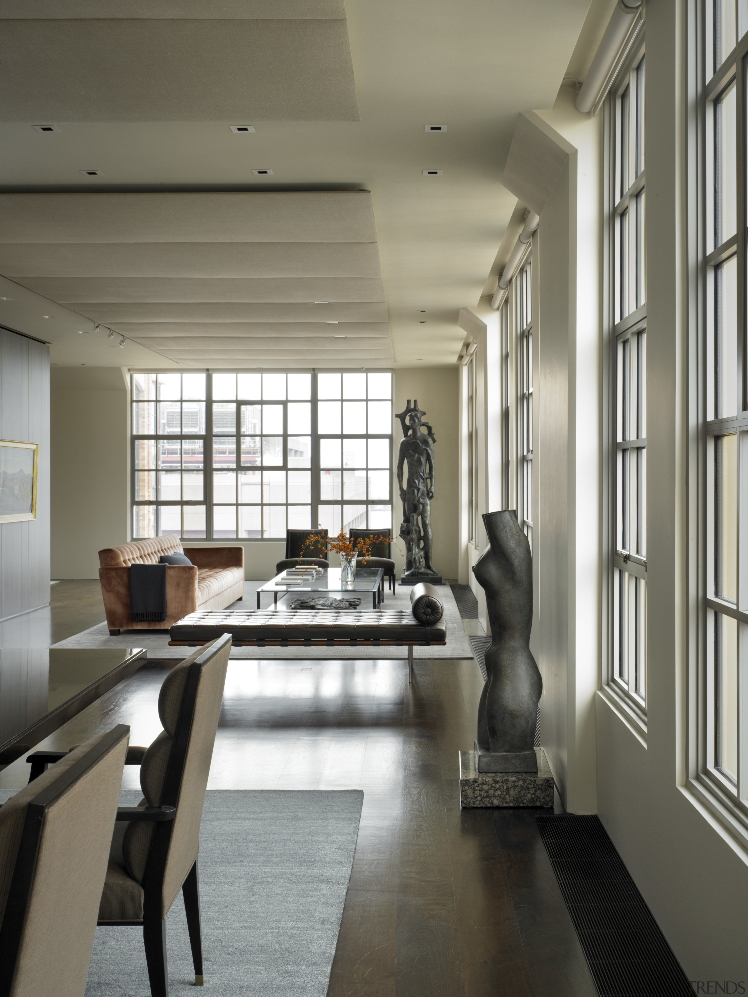 View of this contemporary apartment that has been ceiling, floor, flooring, interior design, living room, loft, gray