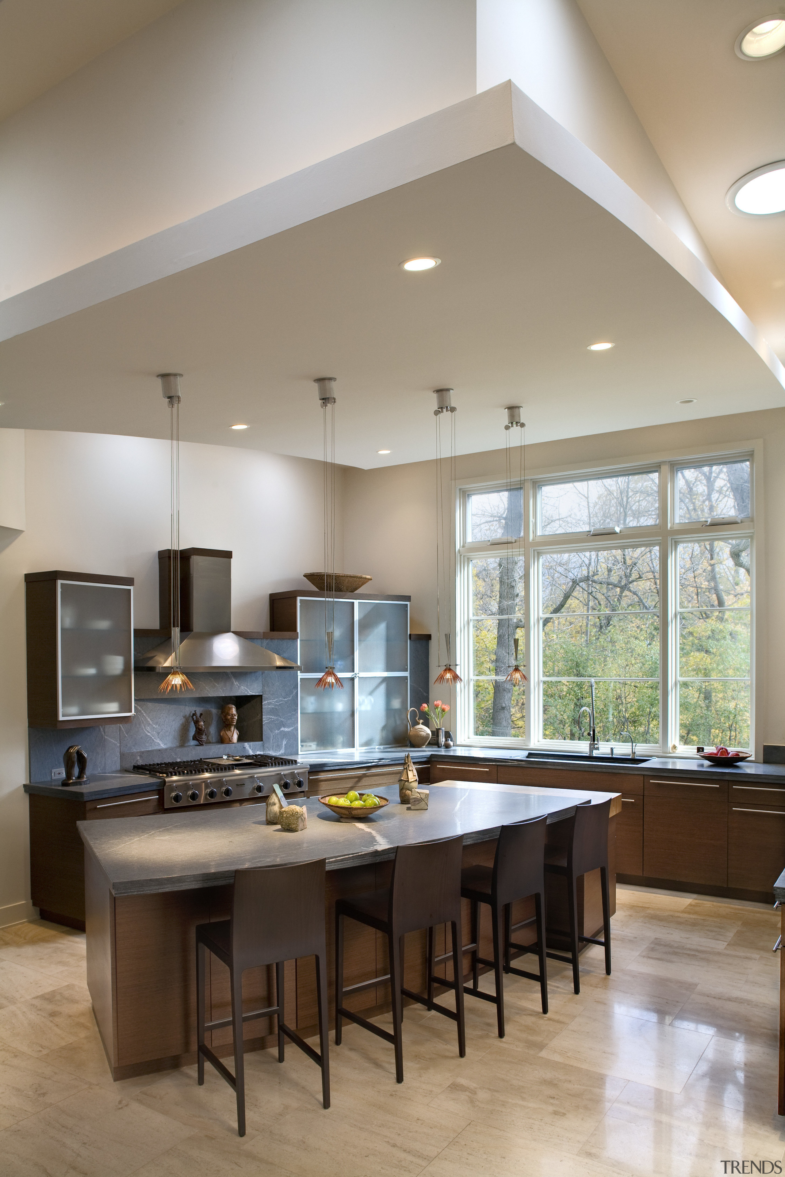 View of kitchen featuring kitchen island with 4 ceiling, countertop, cuisine classique, daylighting, floor, interior design, kitchen, real estate, room, gray, brown