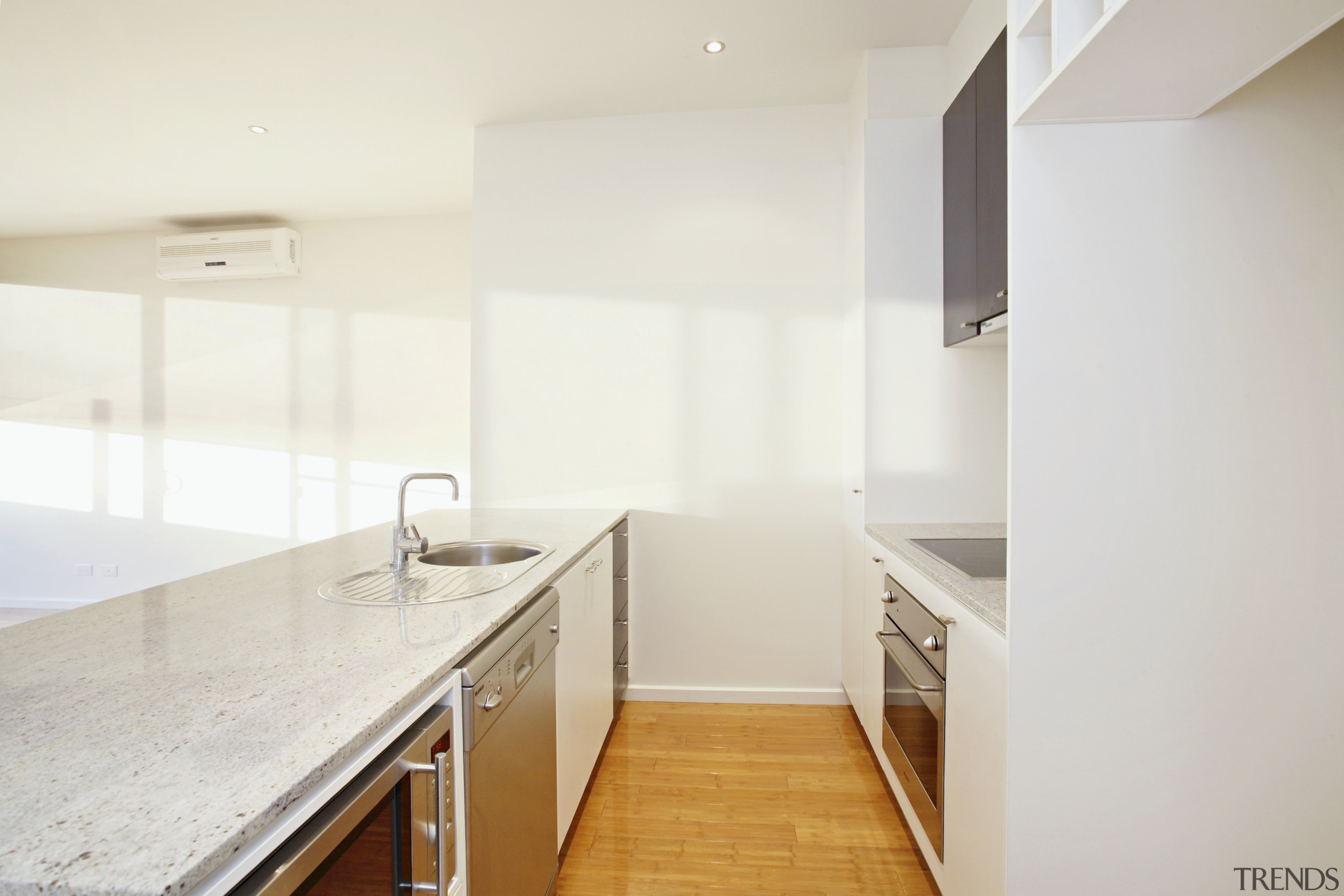 CaesarStone benchtops and stainless steel appliances are features apartment, architecture, countertop, floor, home, house, interior design, kitchen, property, real estate, room, white