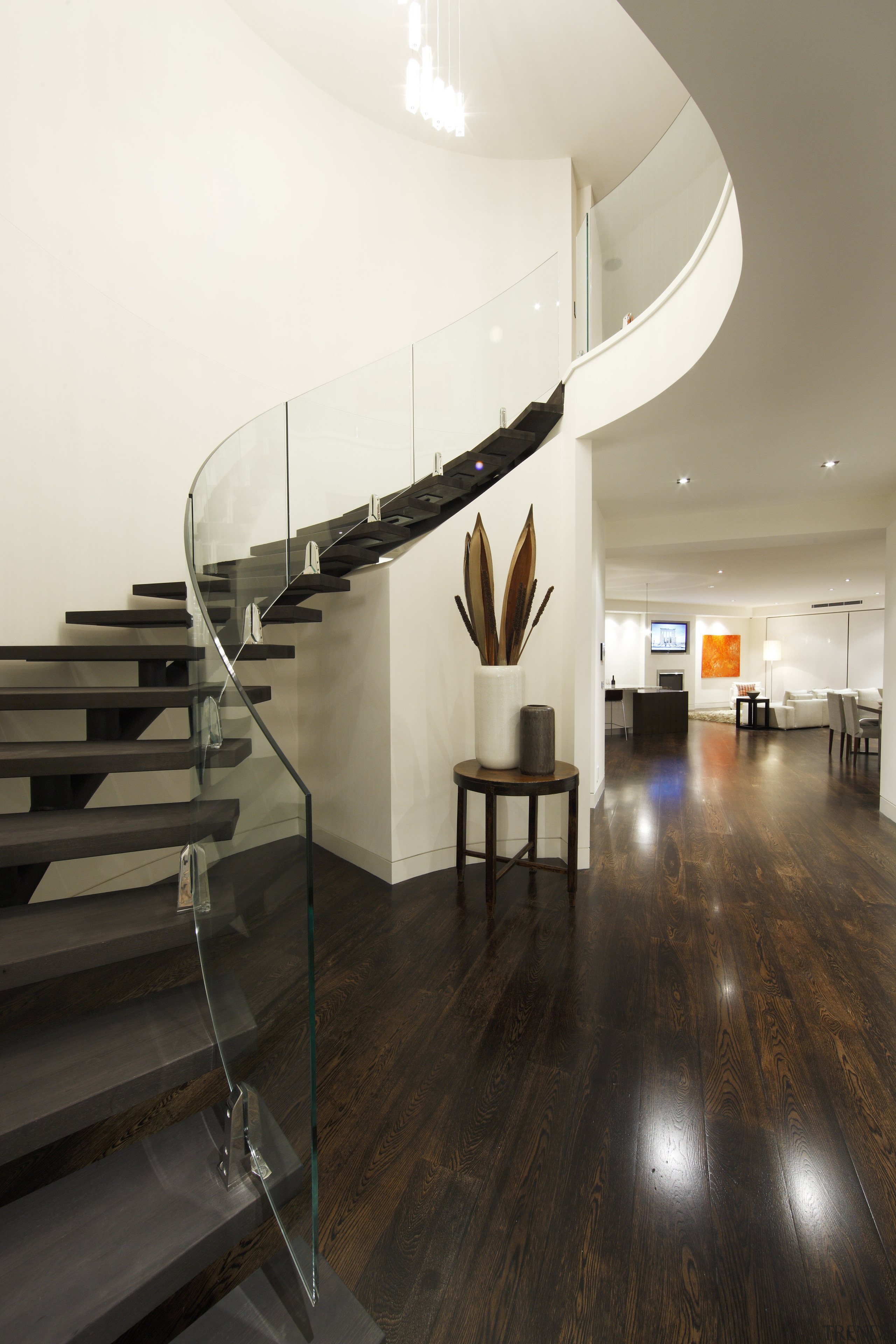 View of a stairway which features a curved architecture, ceiling, daylighting, floor, flooring, handrail, interior design, product design, stairs, white, black