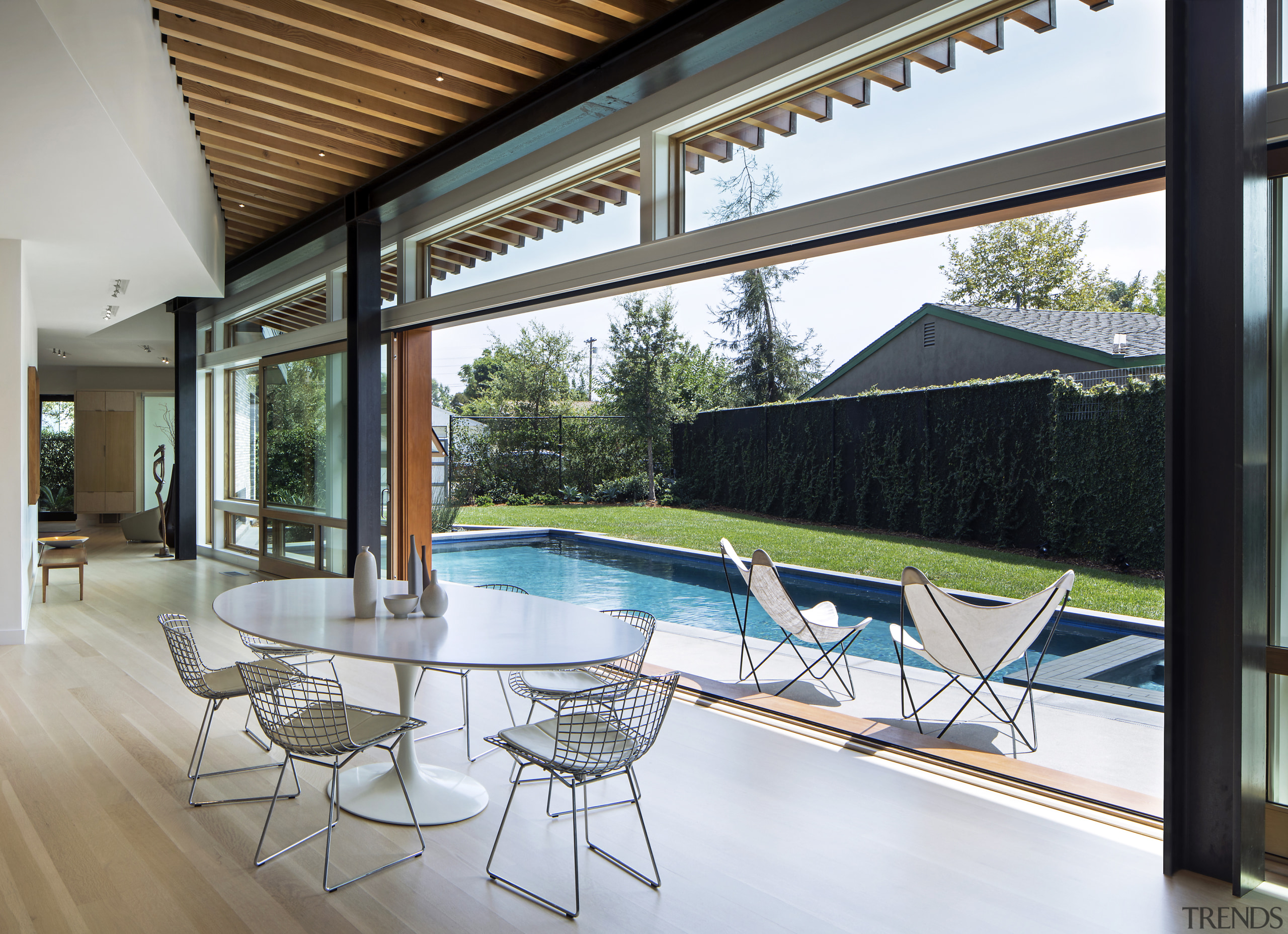 ​​​​​​​Sliding glass doors open up the dining area architecture, courtyard, furniture, home, house, interior design, shade, swimming pool, Nils Finne, Finne Architects