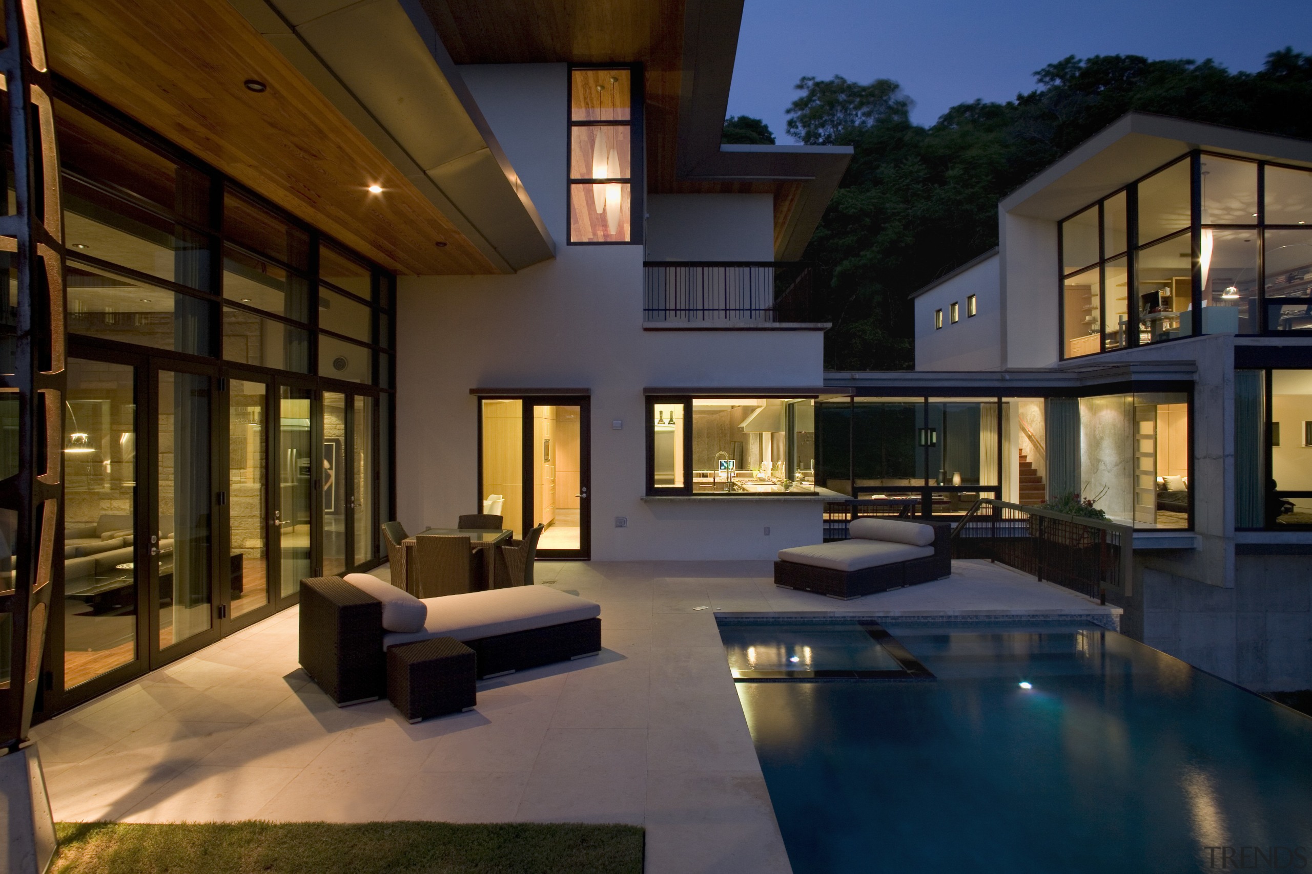 Exterior view of this modern home, featuring the architecture, condominium, courtyard, estate, home, house, interior design, lighting, living room, lobby, property, real estate, window, brown