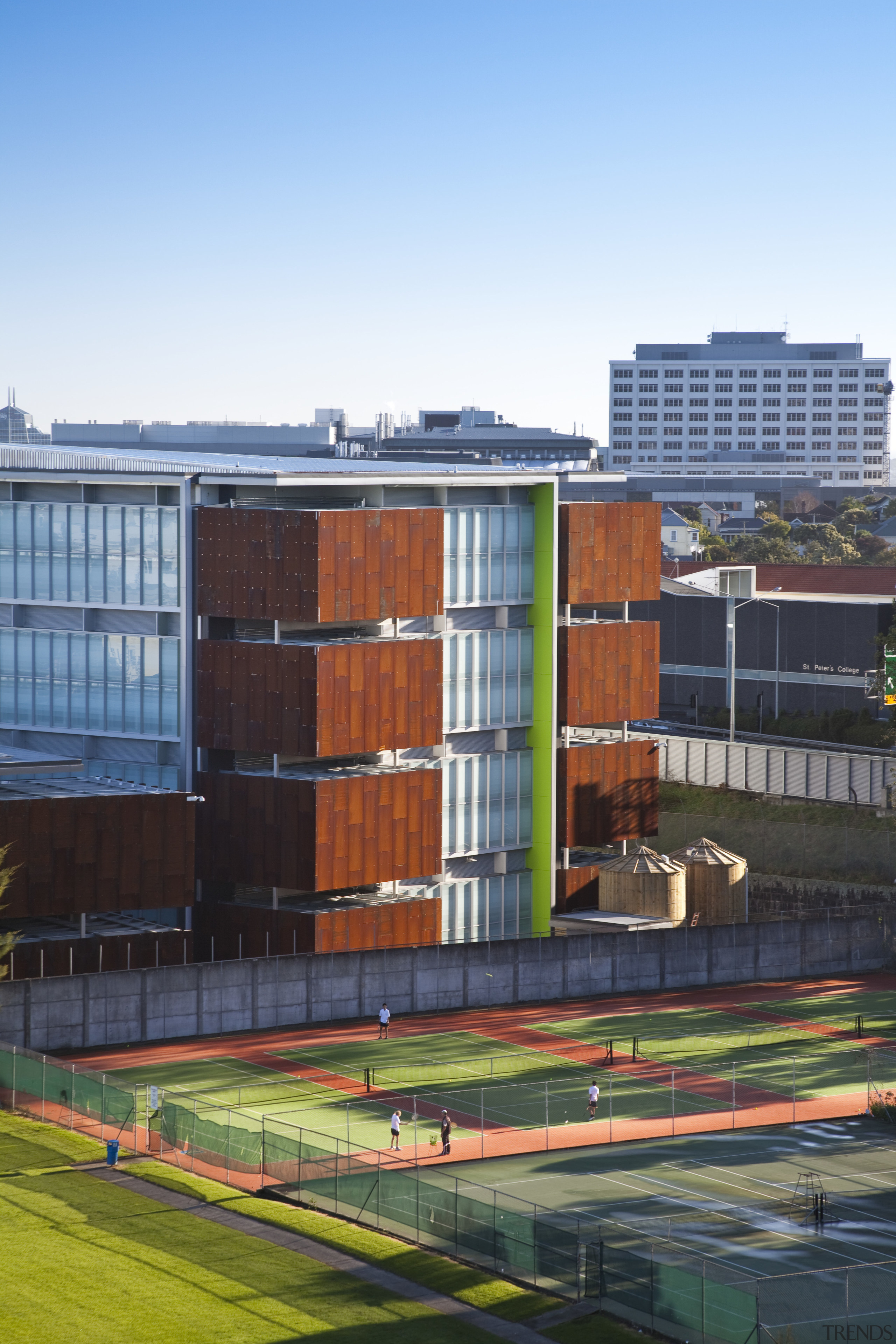 View of the Mt Eden Corrections Facility. - architecture, building, city, corporate headquarters, daytime, facade, house, metropolitan area, real estate, residential area, roof, sky, urban area