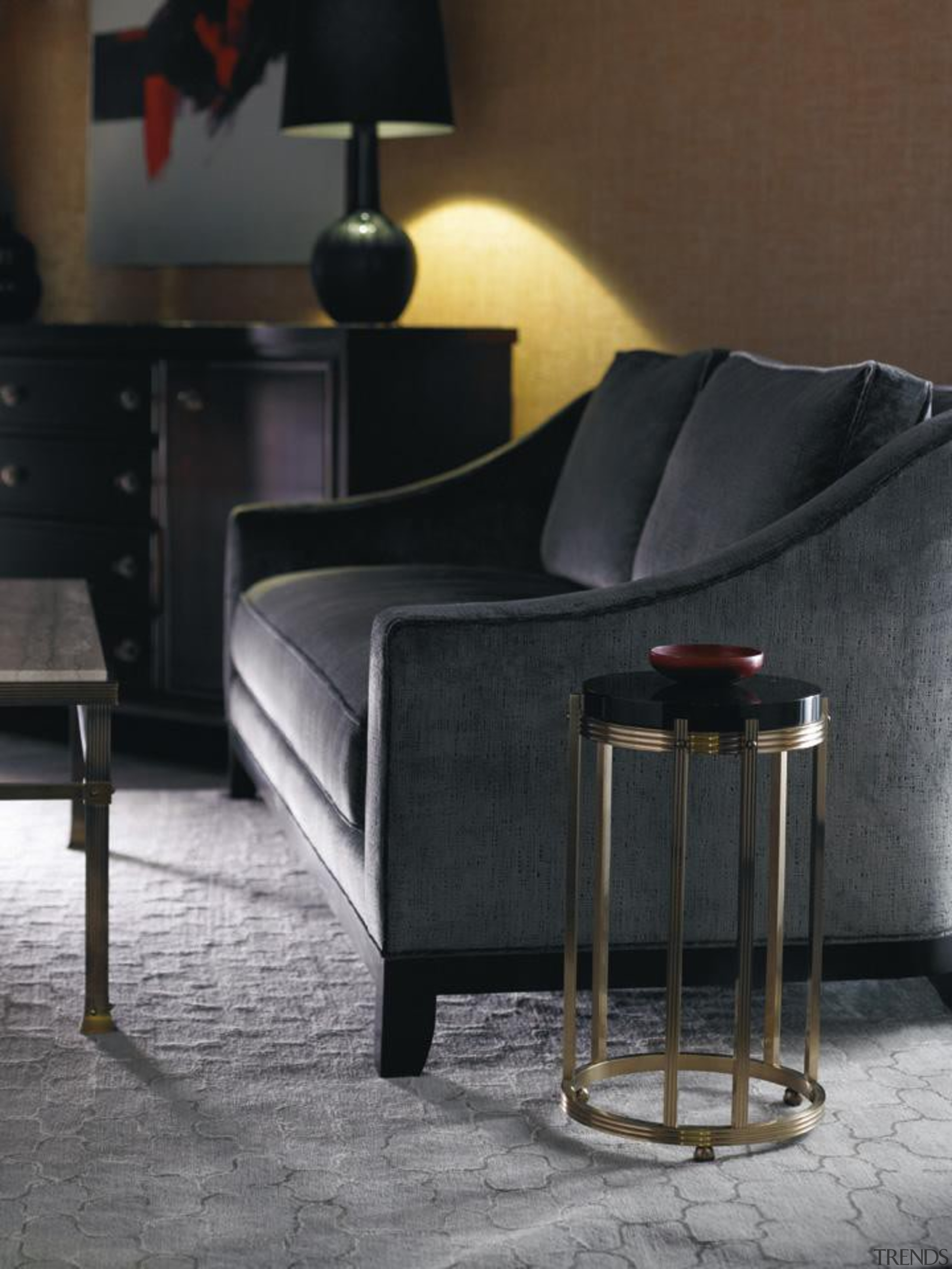 Vintage, antique, and modern pieces creatively express a chair, coffee table, floor, flooring, furniture, interior design, lamp, light fixture, lighting, living room, product design, table, black, gray