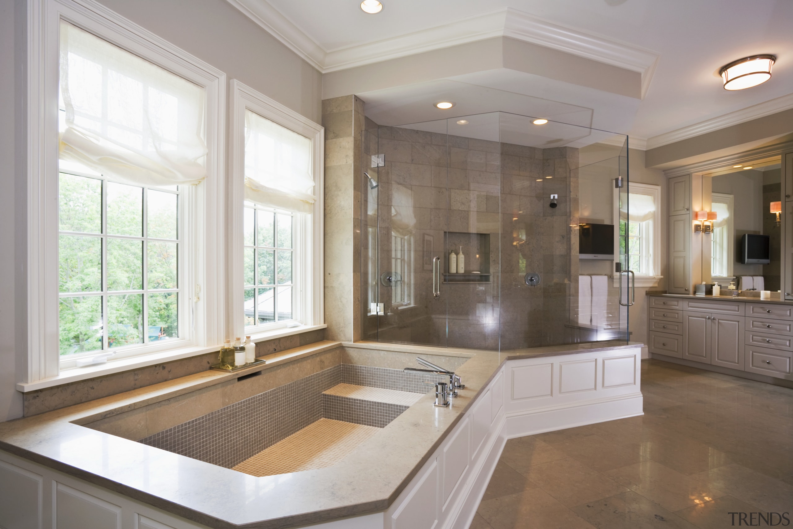 View of bath tub which features a limestone cabinetry, ceiling, countertop, cuisine classique, estate, floor, flooring, home, interior design, kitchen, real estate, room, sink, tile, window, wood flooring, gray, brown