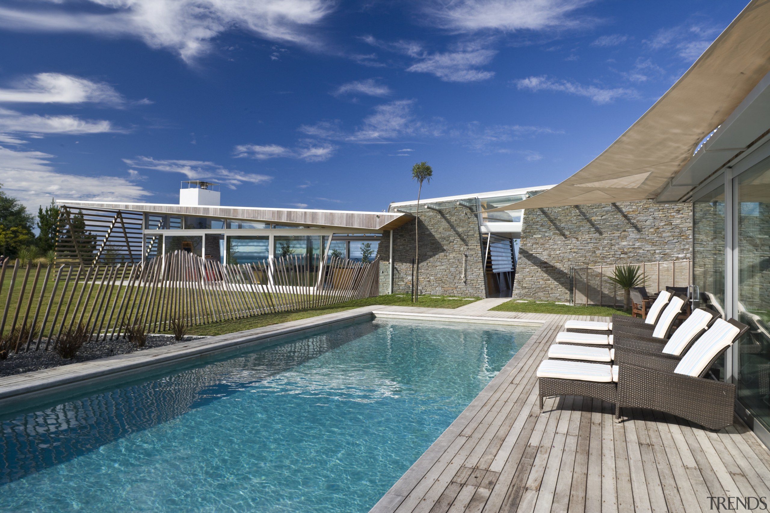 Exterior view of the outdoor area with pool, condominium, estate, home, house, leisure, property, real estate, resort, resort town, sky, swimming pool, villa, water, blue, gray