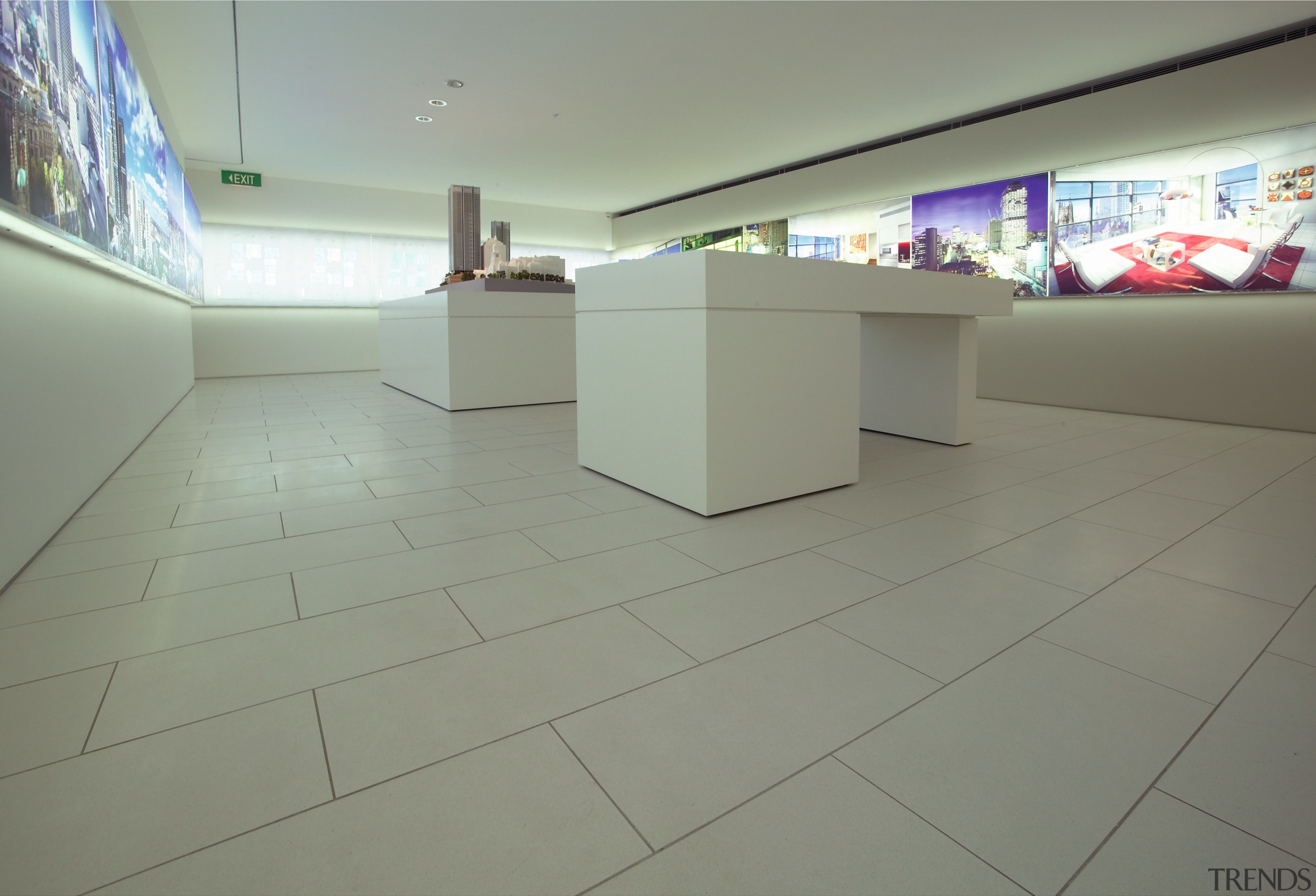 Showroom area with cream stone floor tiles, white architecture, daylighting, floor, flooring, glass, hardwood, interior design, property, real estate, tile, wood, wood flooring, gray