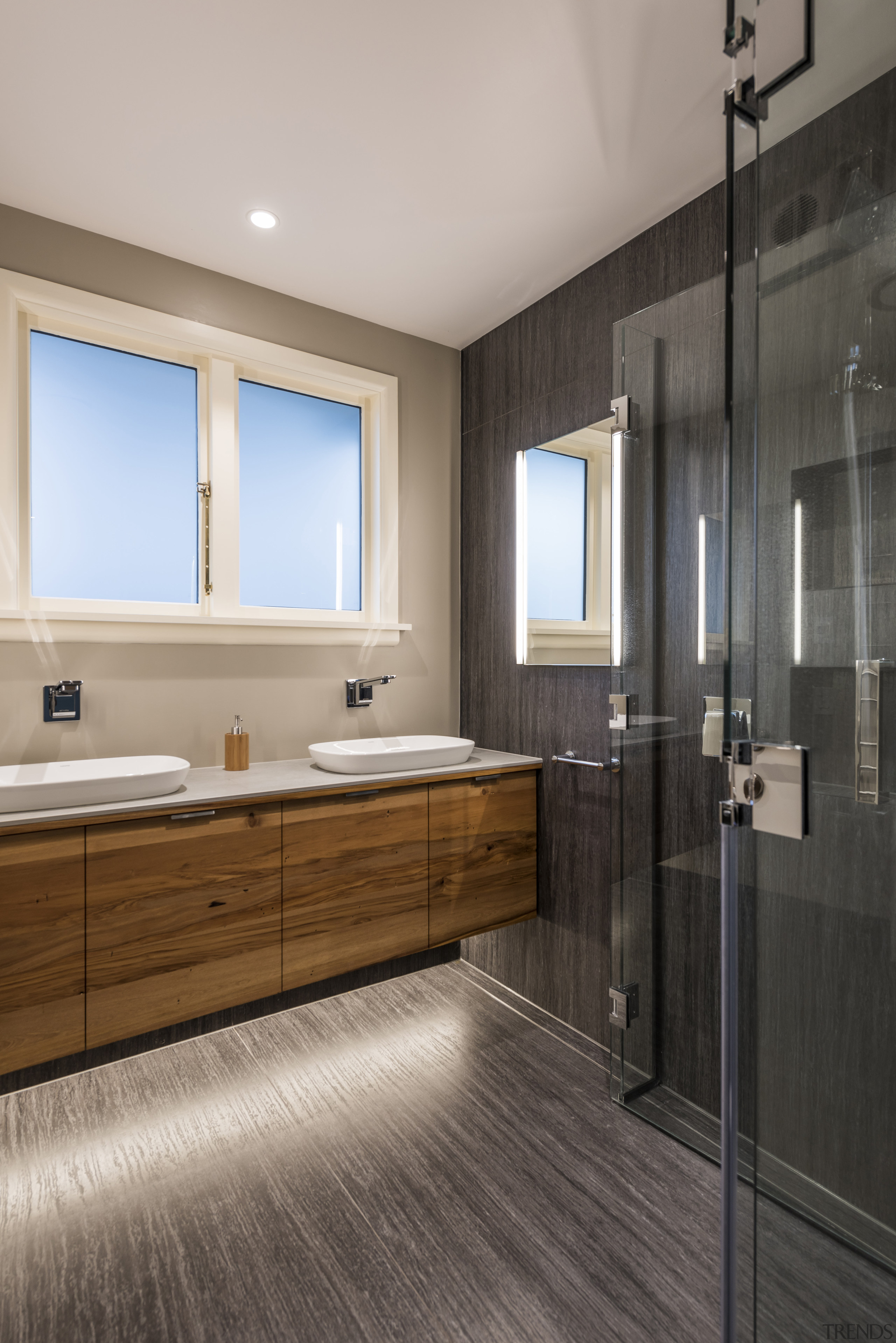 ​​​​​​​As in other areas of the modest-sized home, bathroom, floor, flooring, interior design, tile floor, higham architects, 