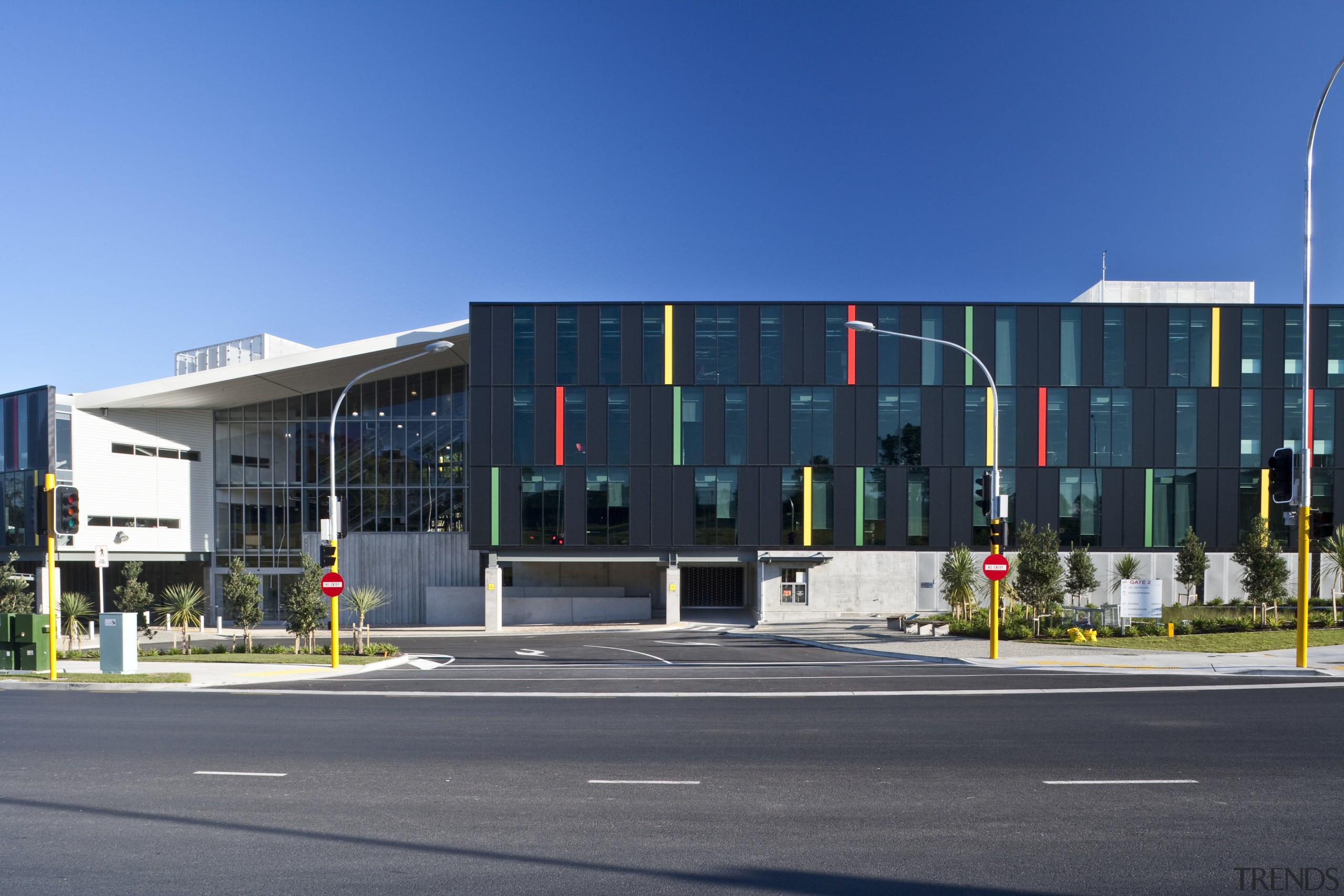 Exterior view of this high school - Exterior architecture, building, city, commercial building, corporate headquarters, daytime, facade, headquarters, house, metropolitan area, mixed use, neighbourhood, real estate, residential area, sky, structure, blue