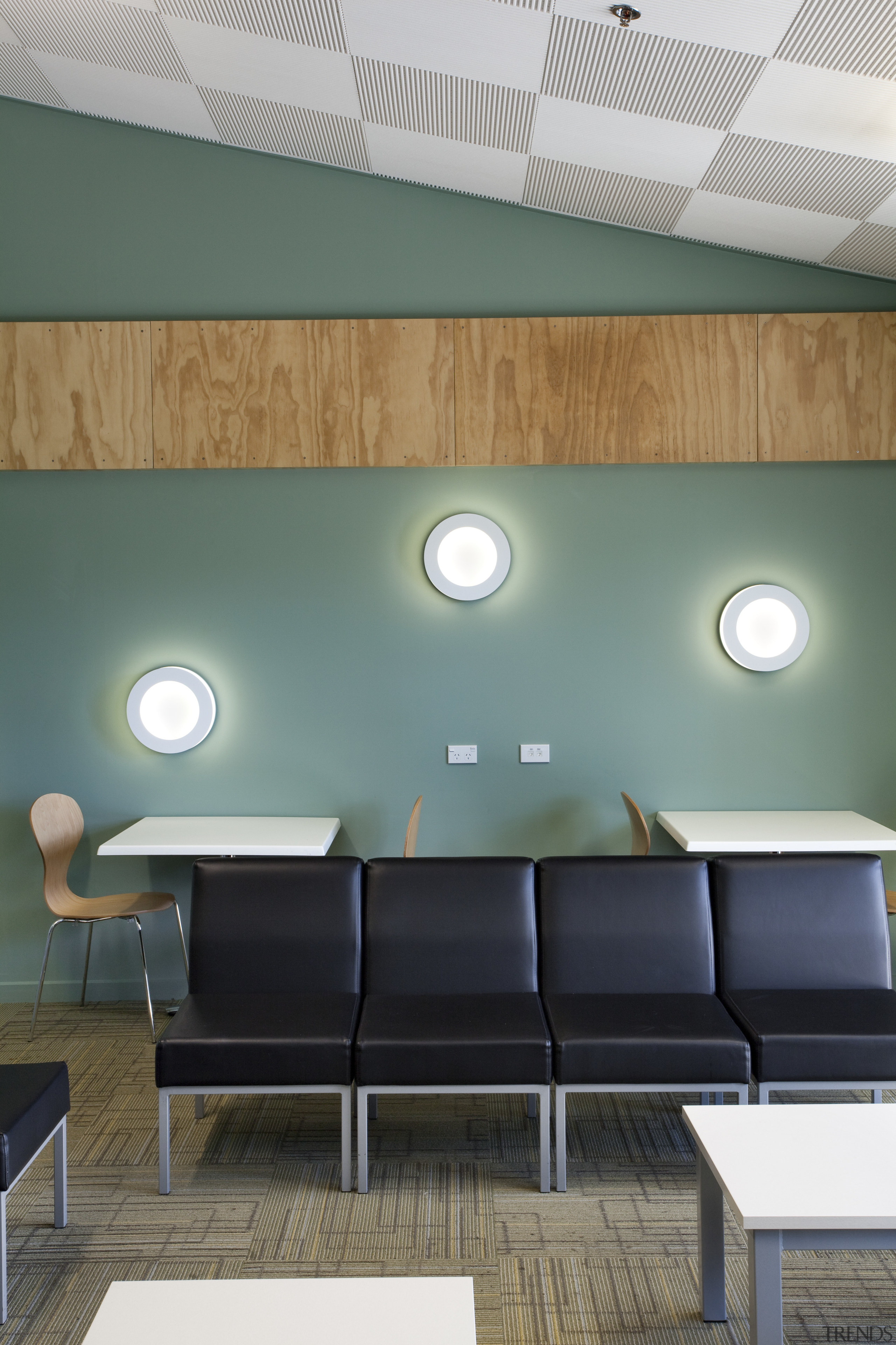 Vew of waiting area with black seats, circular architecture, ceiling, daylighting, furniture, home, house, interior design, lighting, living room, product design, table, wall, teal