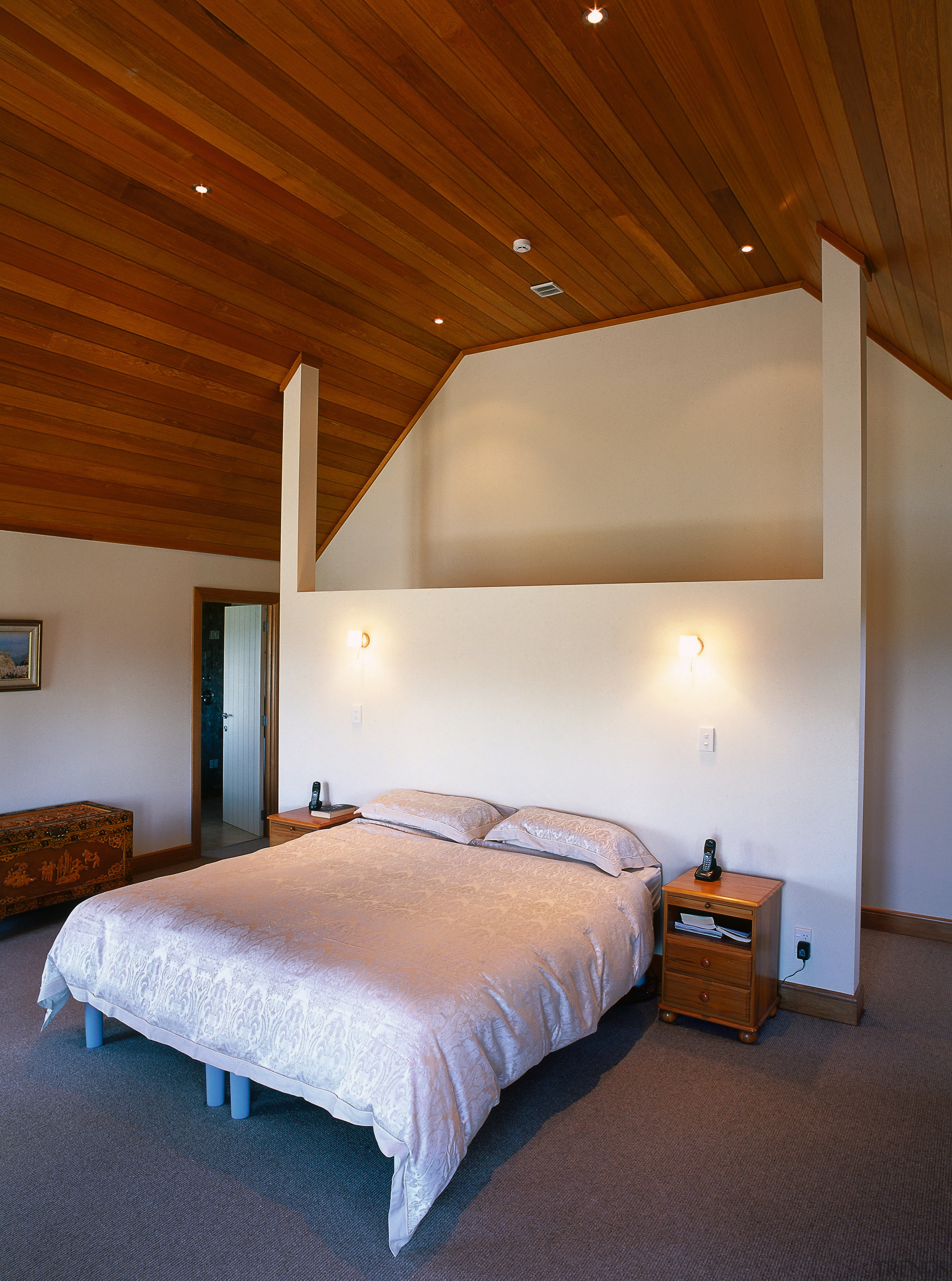 Bedroom with white headboard and walls, and timber architecture, bed, bed frame, bedroom, ceiling, daylighting, estate, floor, furniture, home, hotel, house, interior design, lighting, property, real estate, room, suite, wall, wood, brown, gray