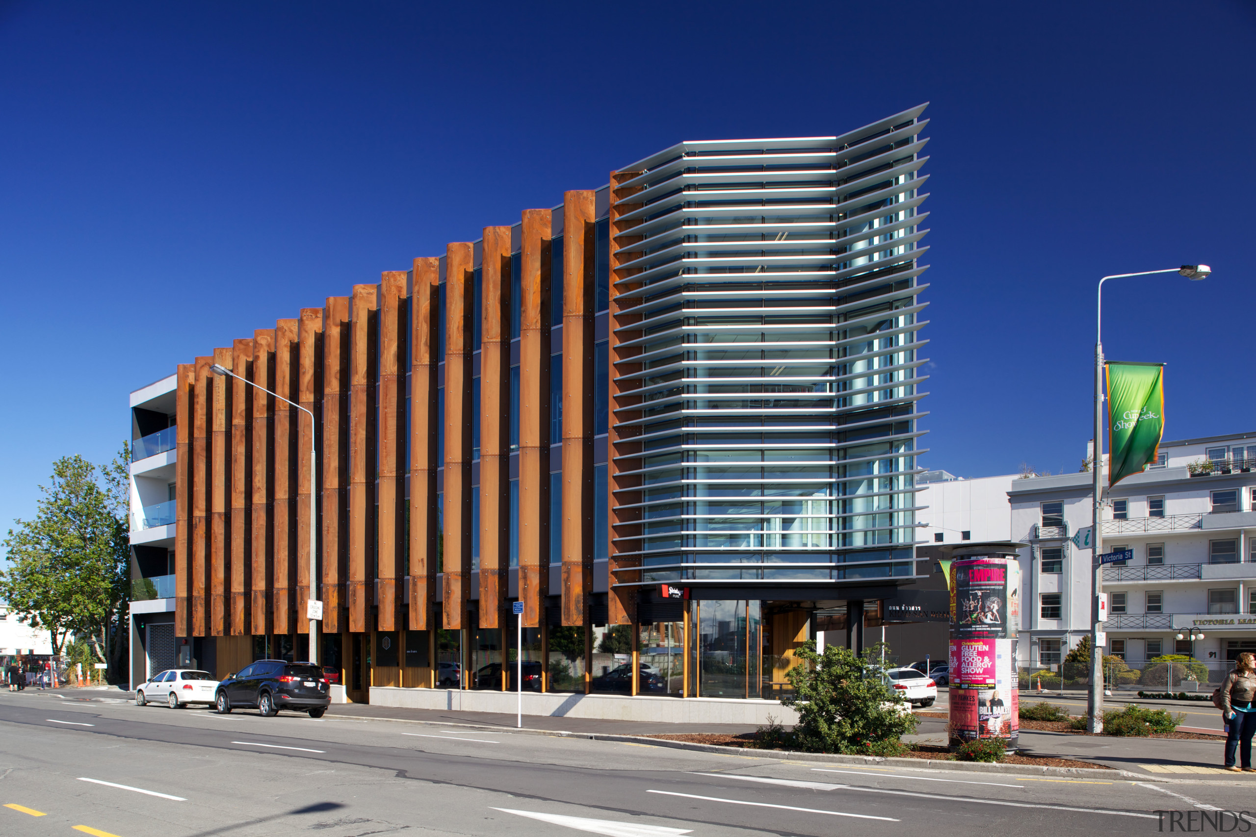 Corten steel fins define the northwest exterior of apartment, architecture, building, city, commercial building, condominium, corporate headquarters, downtown, facade, headquarters, metropolis, metropolitan area, mixed use, neighbourhood, real estate, residential area, sky, tower block, urban area, blue