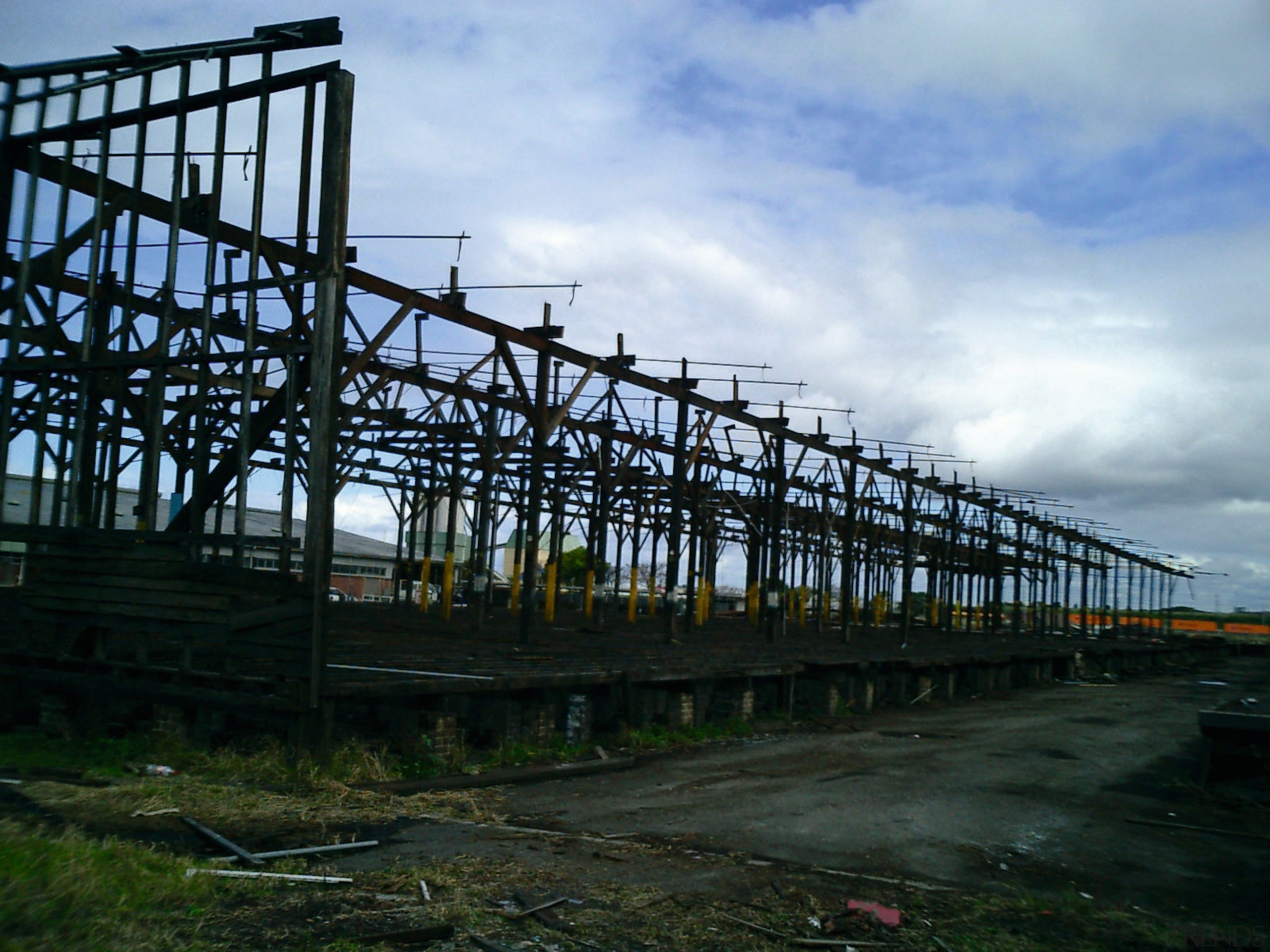 Old warehouse showing old wooden beam structure. - bridge, cloud, fixed link, girder bridge, sky, skyway, structure, black, teal