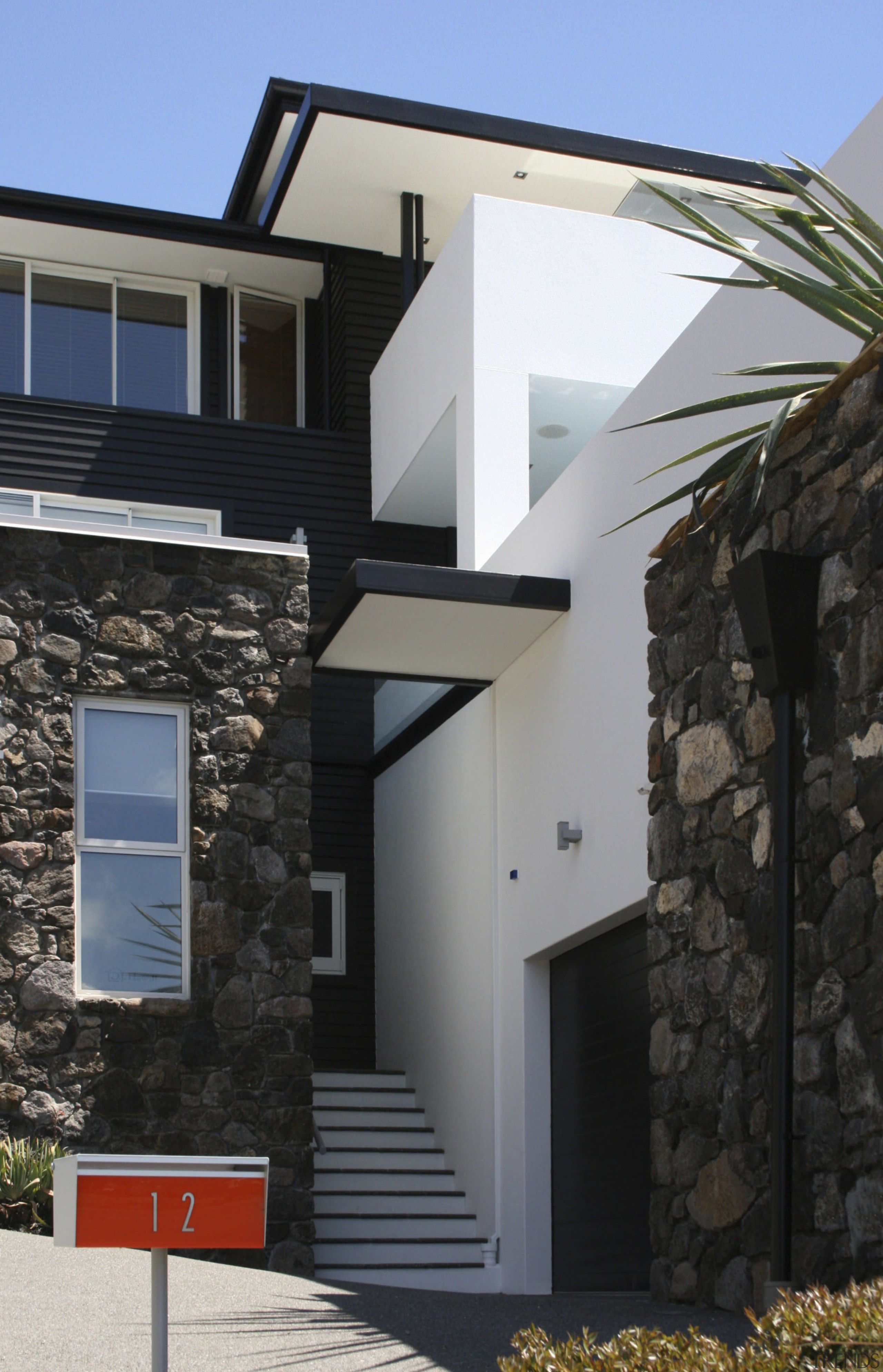 View of DJ Hewitt house built on a architecture, building, elevation, facade, home, house, property, real estate, residential area, siding, window, black, gray