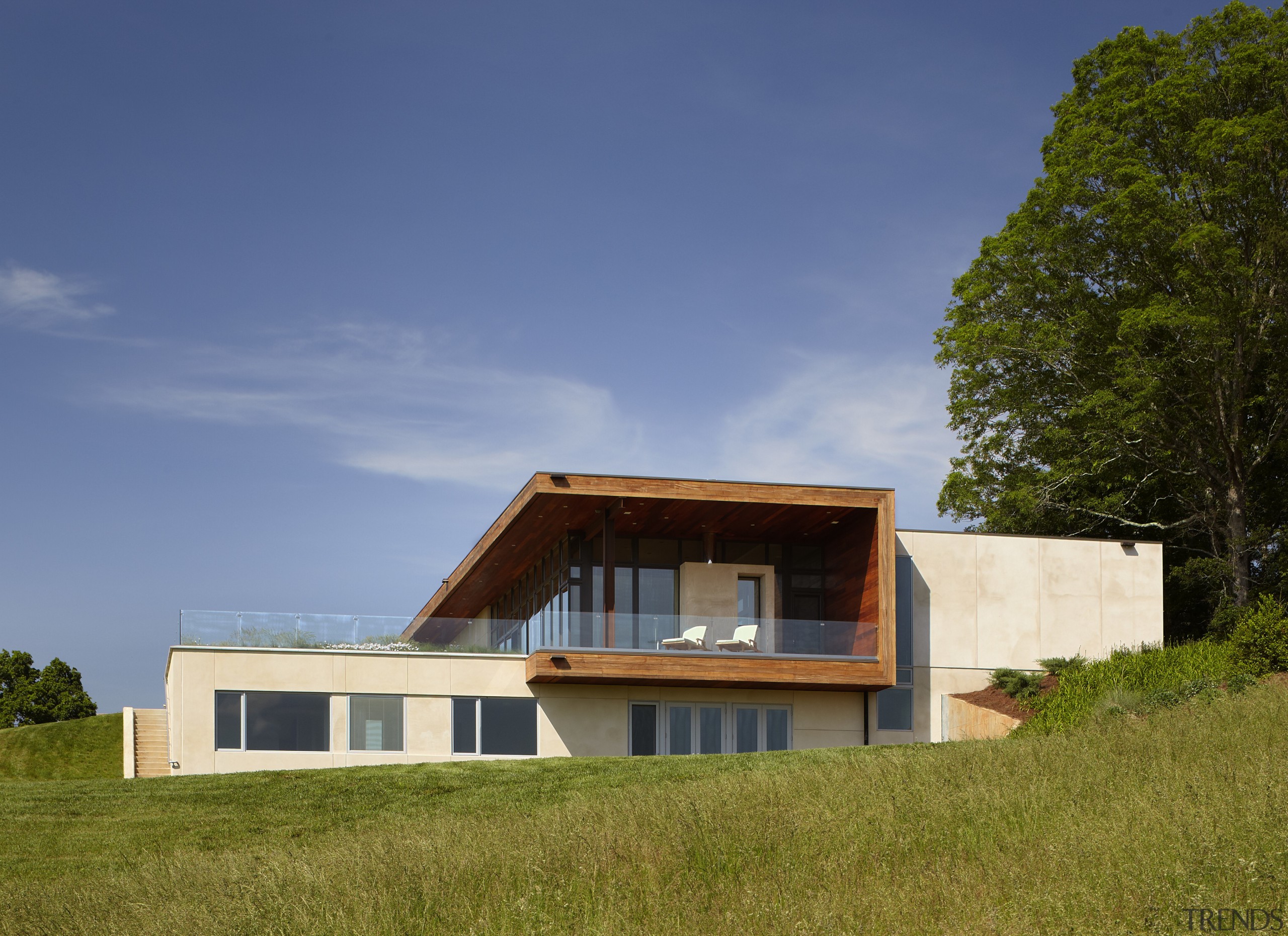 Exterior of house with rusted corten steel. Sustainable architecture, cottage, elevation, estate, facade, farmhouse, home, house, property, real estate, sky, villa, brown, blue
