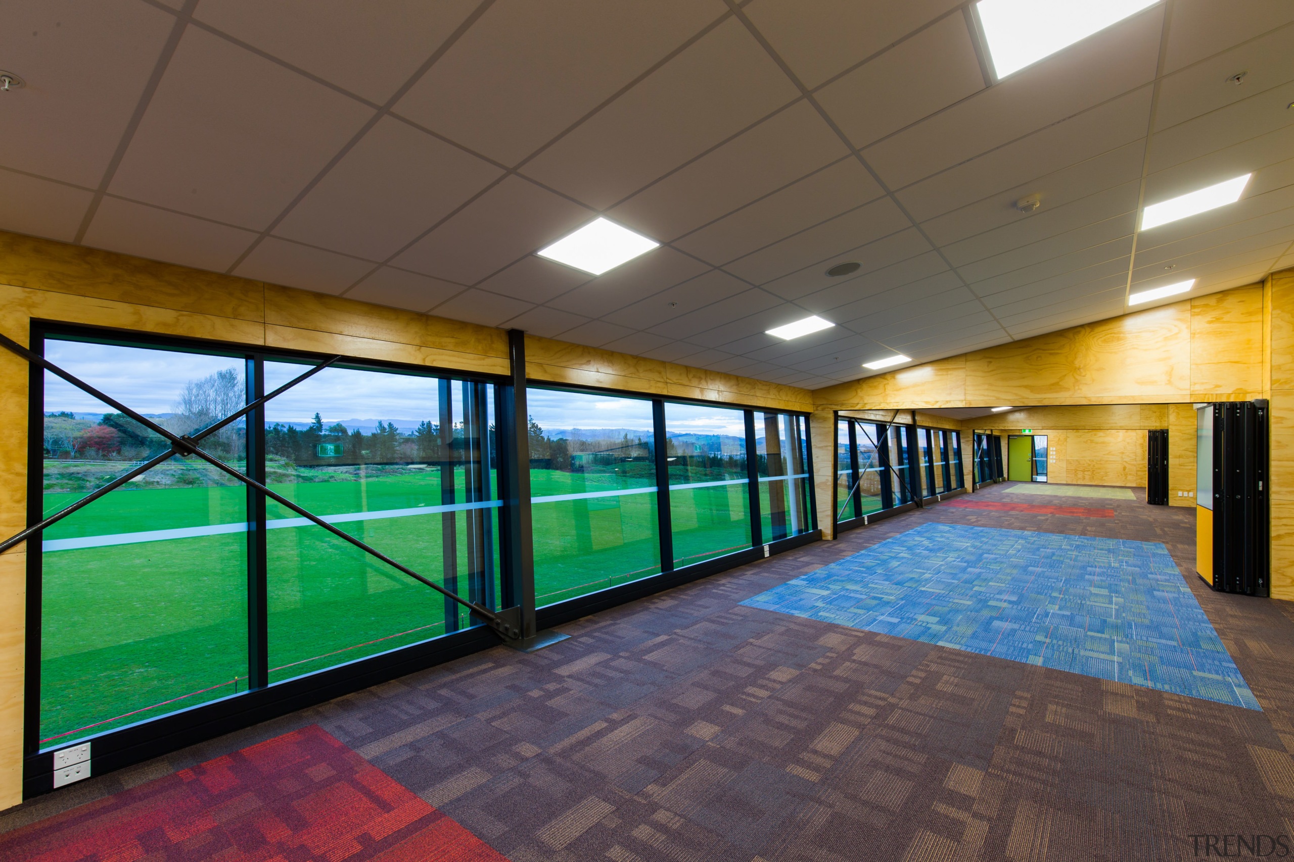 The new ACG Gymnasium offers plenty of natural architecture, ceiling, daylighting, floor, flooring, interior design, leisure centre, real estate, sport venue, structure, wall, brown