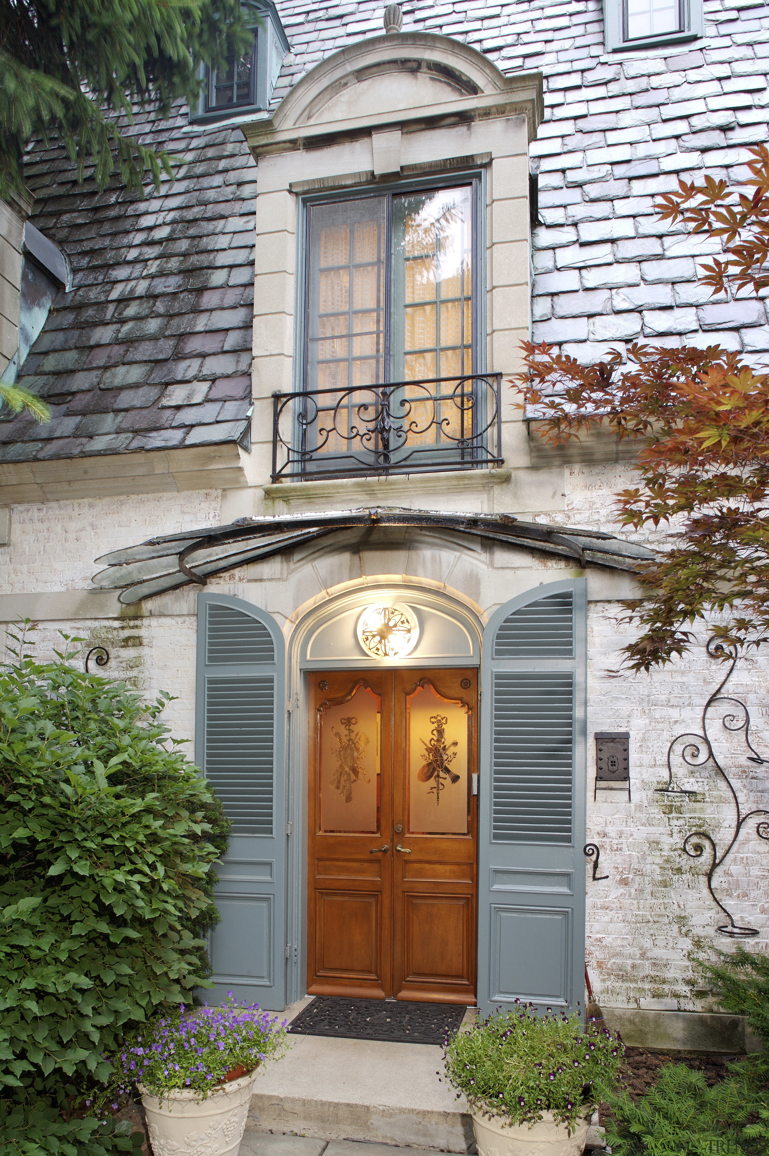 An exterior view of the entrance way to brick, brickwork, cottage, door, estate, facade, home, house, neighbourhood, outdoor structure, porch, property, real estate, residential area, siding, structure, window, gray