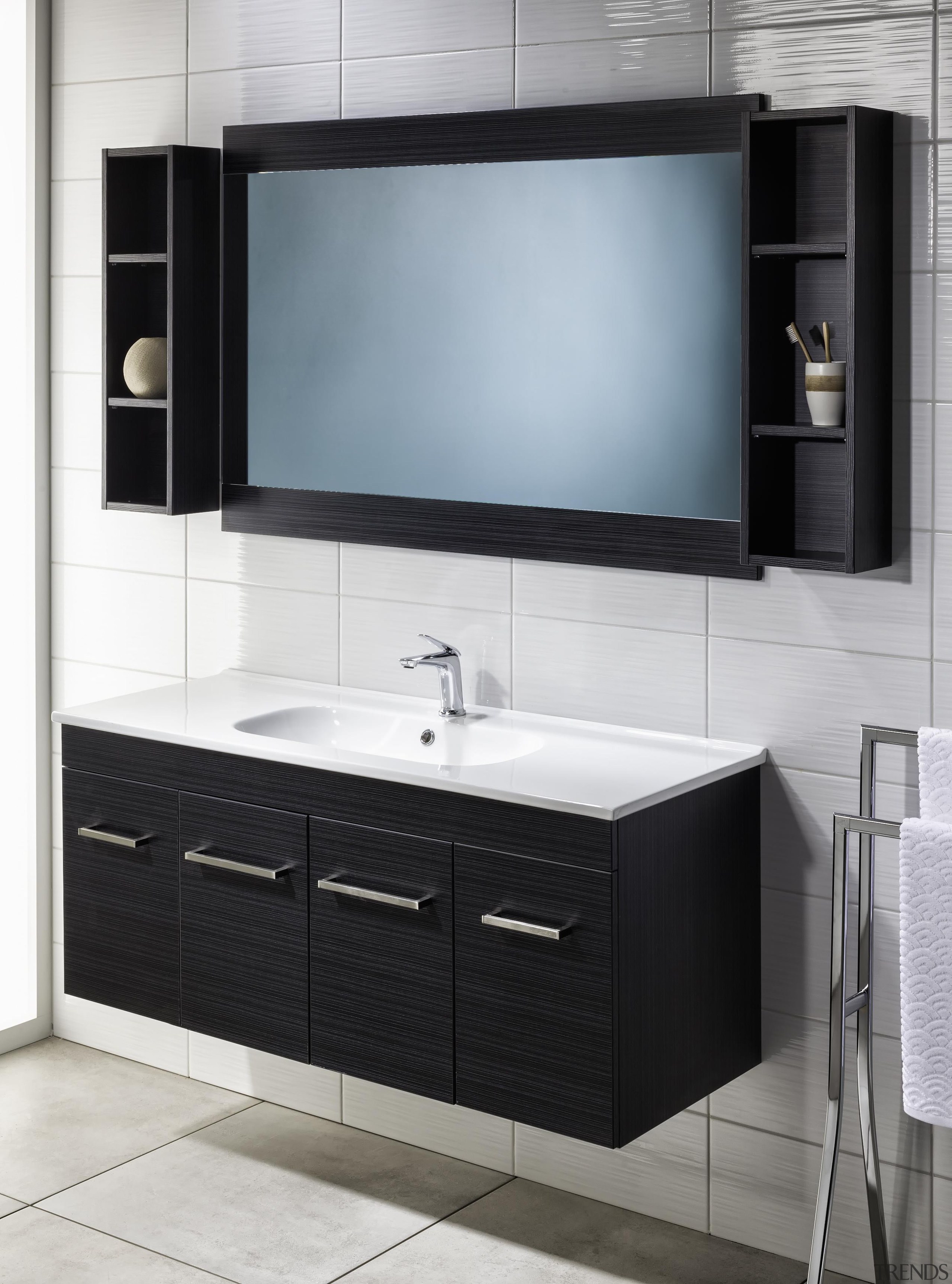 A subtle slim line profile and softly rounded bathroom, bathroom accessory, bathroom cabinet, chest of drawers, furniture, plumbing fixture, product, product design, sink, white, black, gray