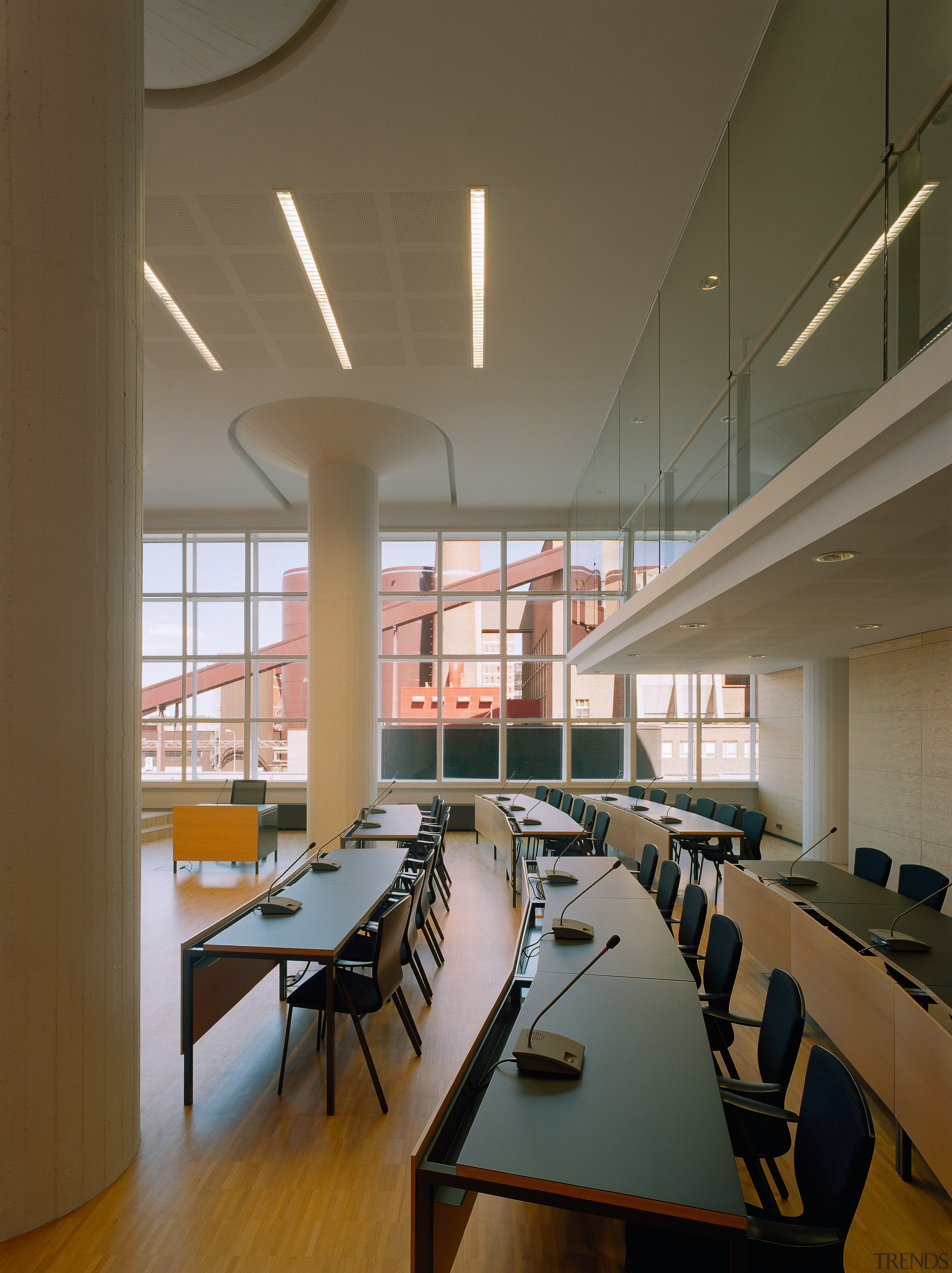 A viewof the conference area. - A viewof architecture, ceiling, classroom, conference hall, daylighting, institution, interior design, office, table, brown