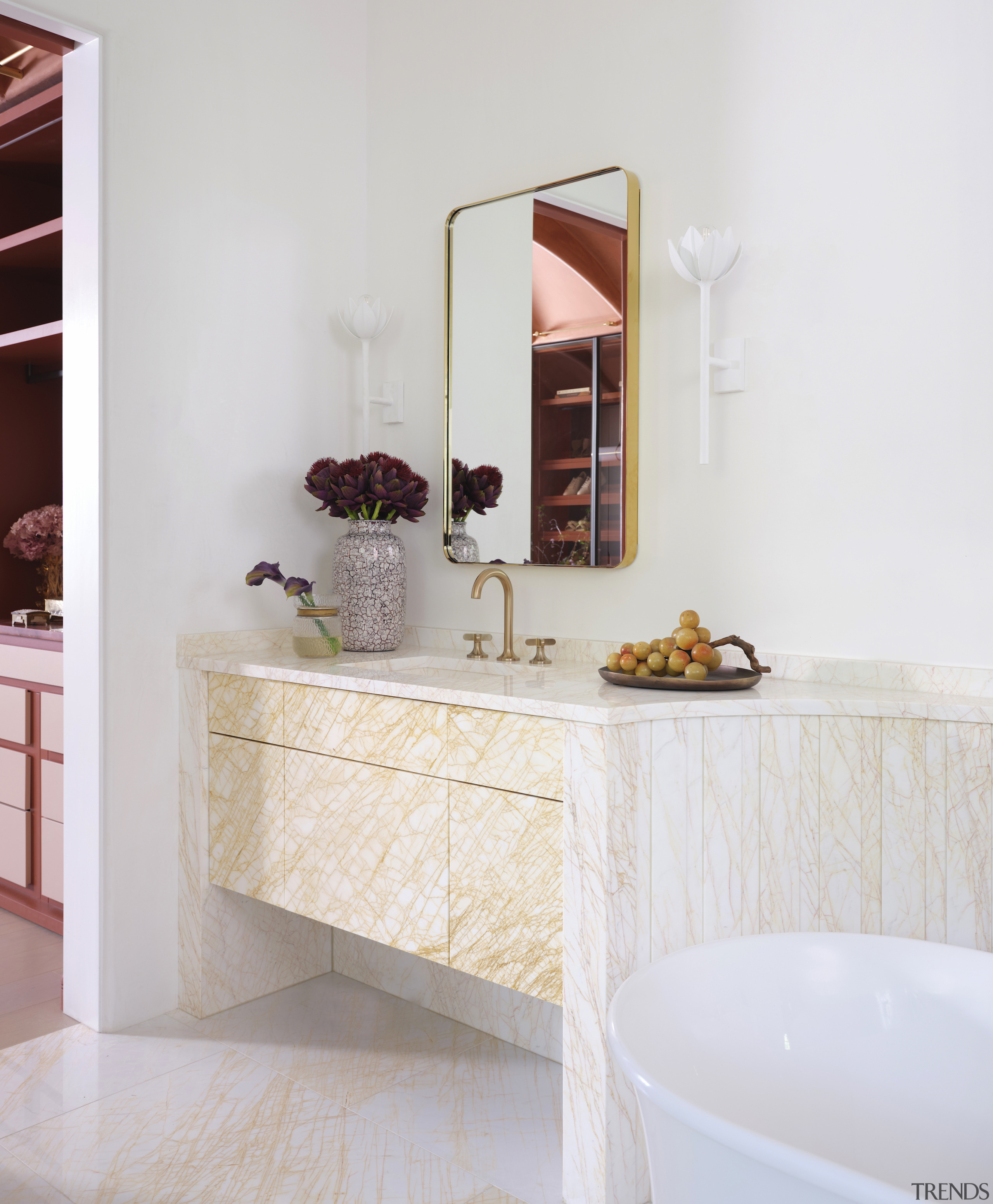 The refined vanity matches the floor finish while 