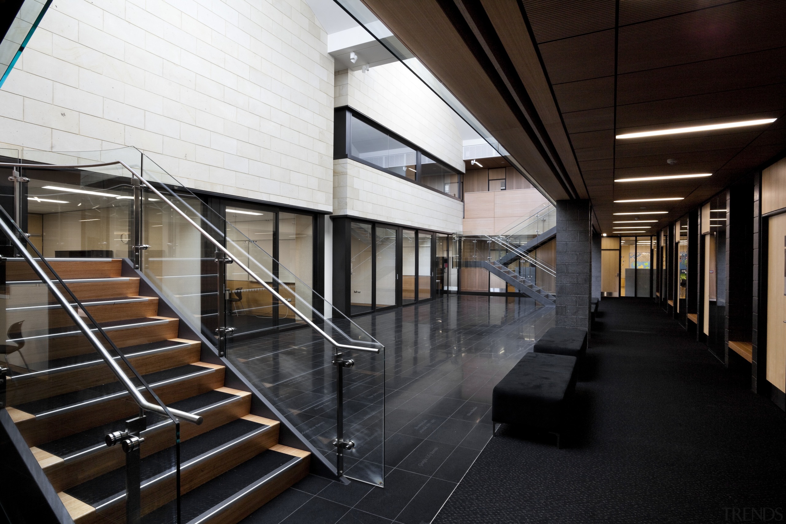 Stairs down to hallway with black seat. - architecture, building, daylighting, structure, black