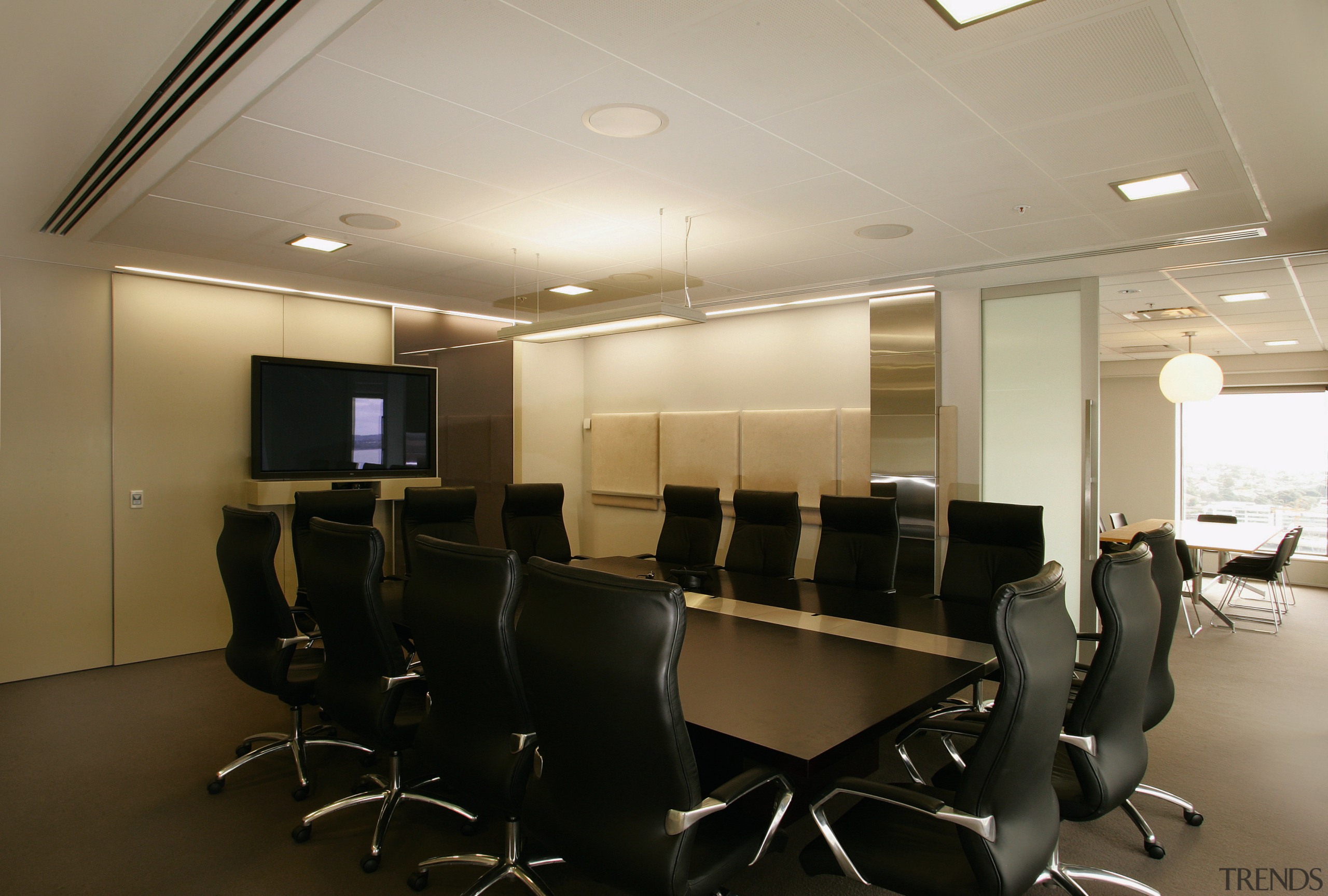 Office boardroom with mahogany table and black chairs. ceiling, conference hall, furniture, interior design, office, black