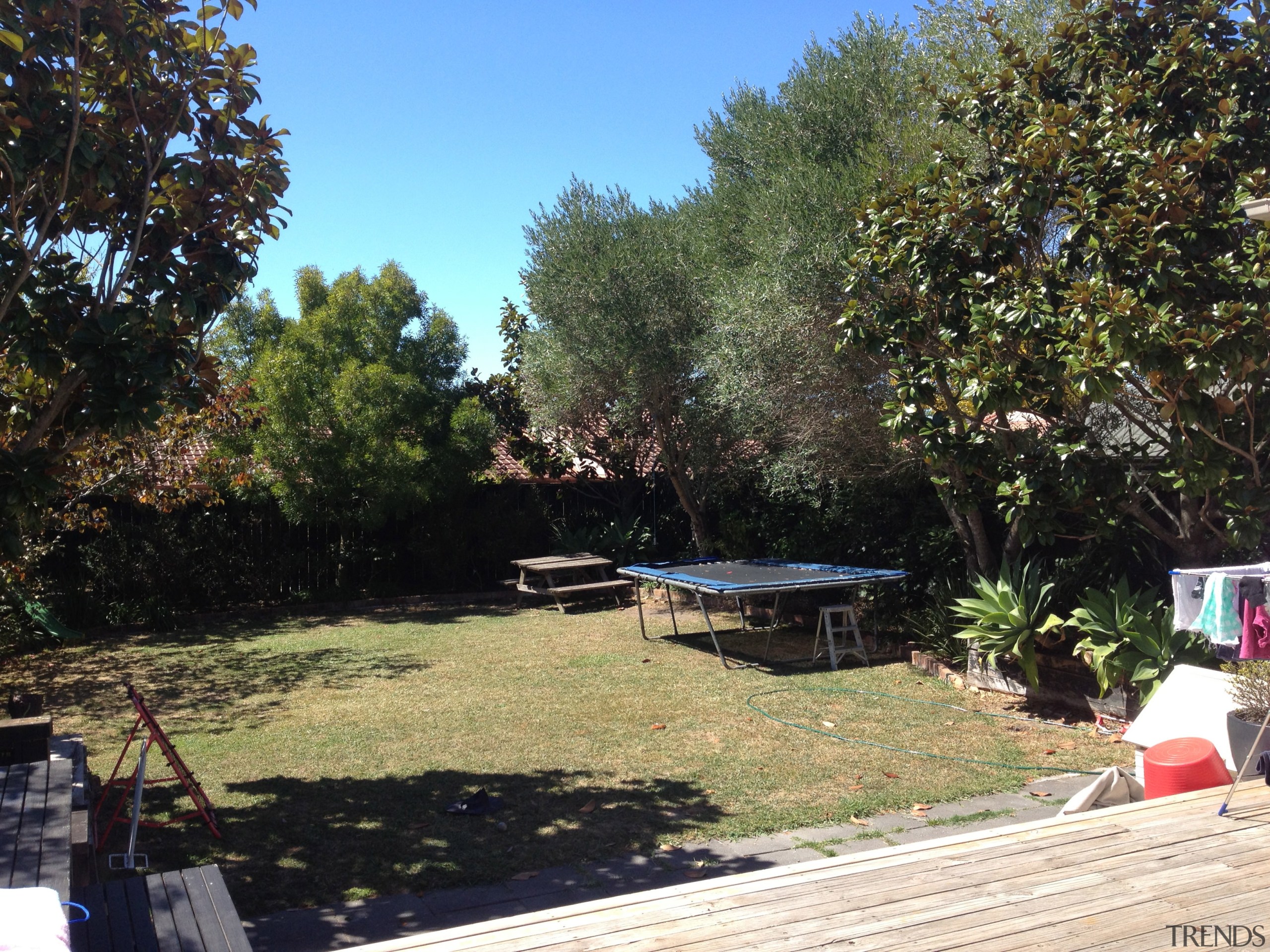 Contemporary black box addition to older home the backyard, cottage, garden, house, landscape, landscaping, lawn, outdoor structure, park, plant, property, real estate, recreation, tree, walkway, yard, black