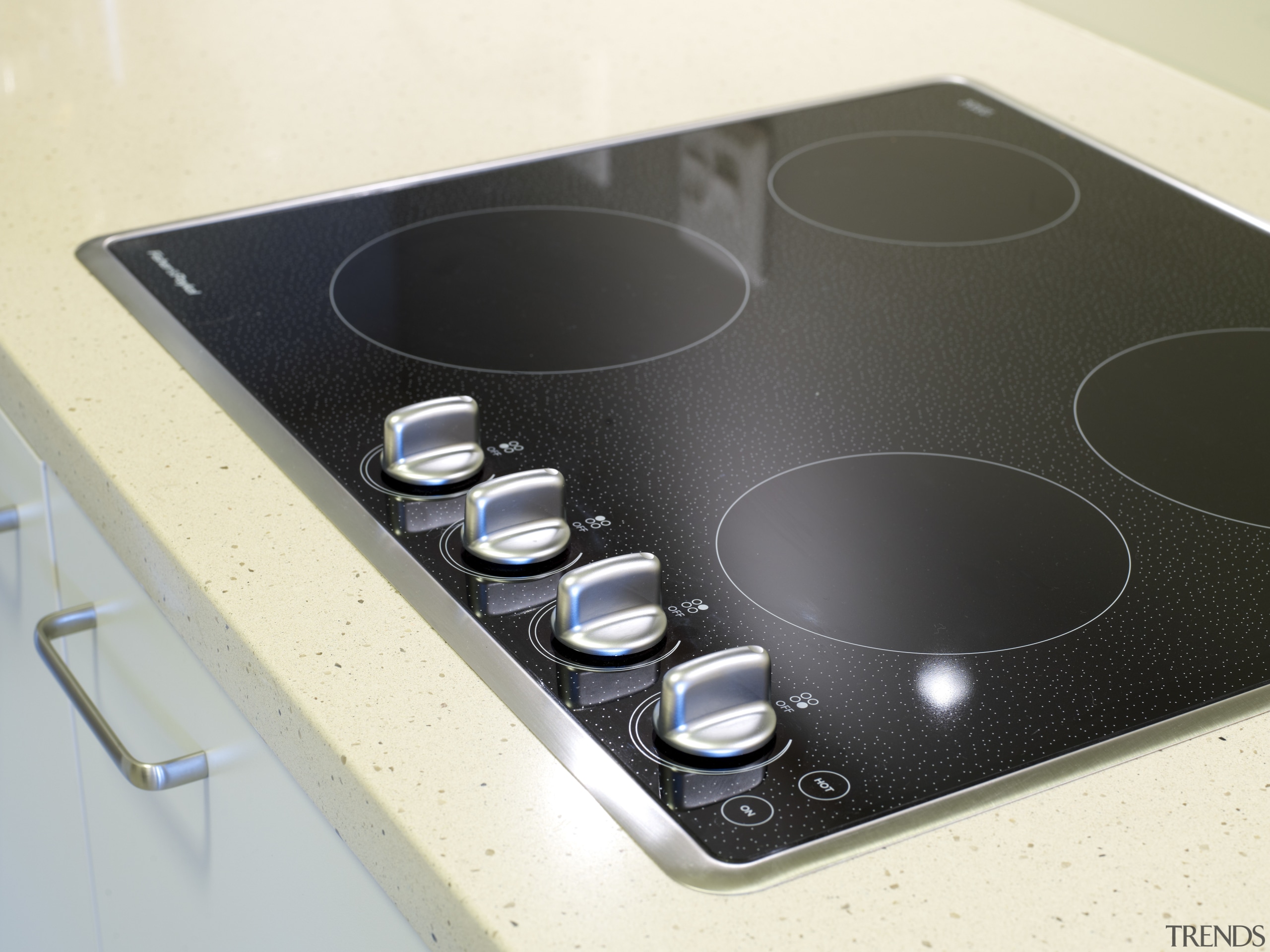 View of the kitchen of a unit at cooktop, electronics, product, product design, white, black