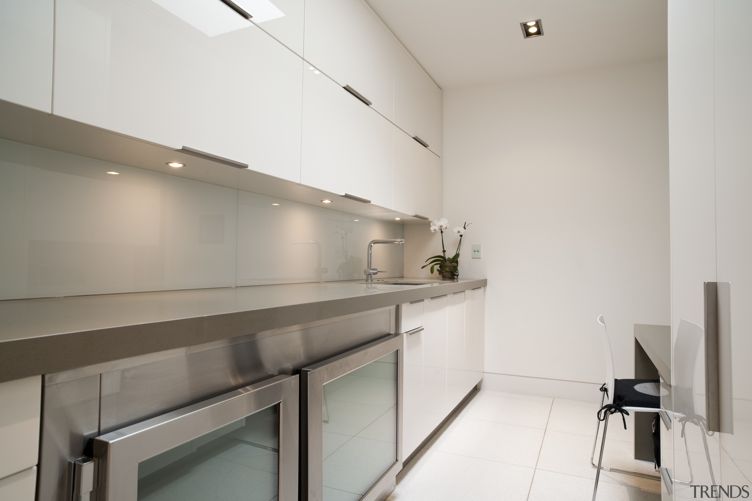 View of contemporary kitchen with light toned cabinetry countertop, interior design, kitchen, property, real estate, gray