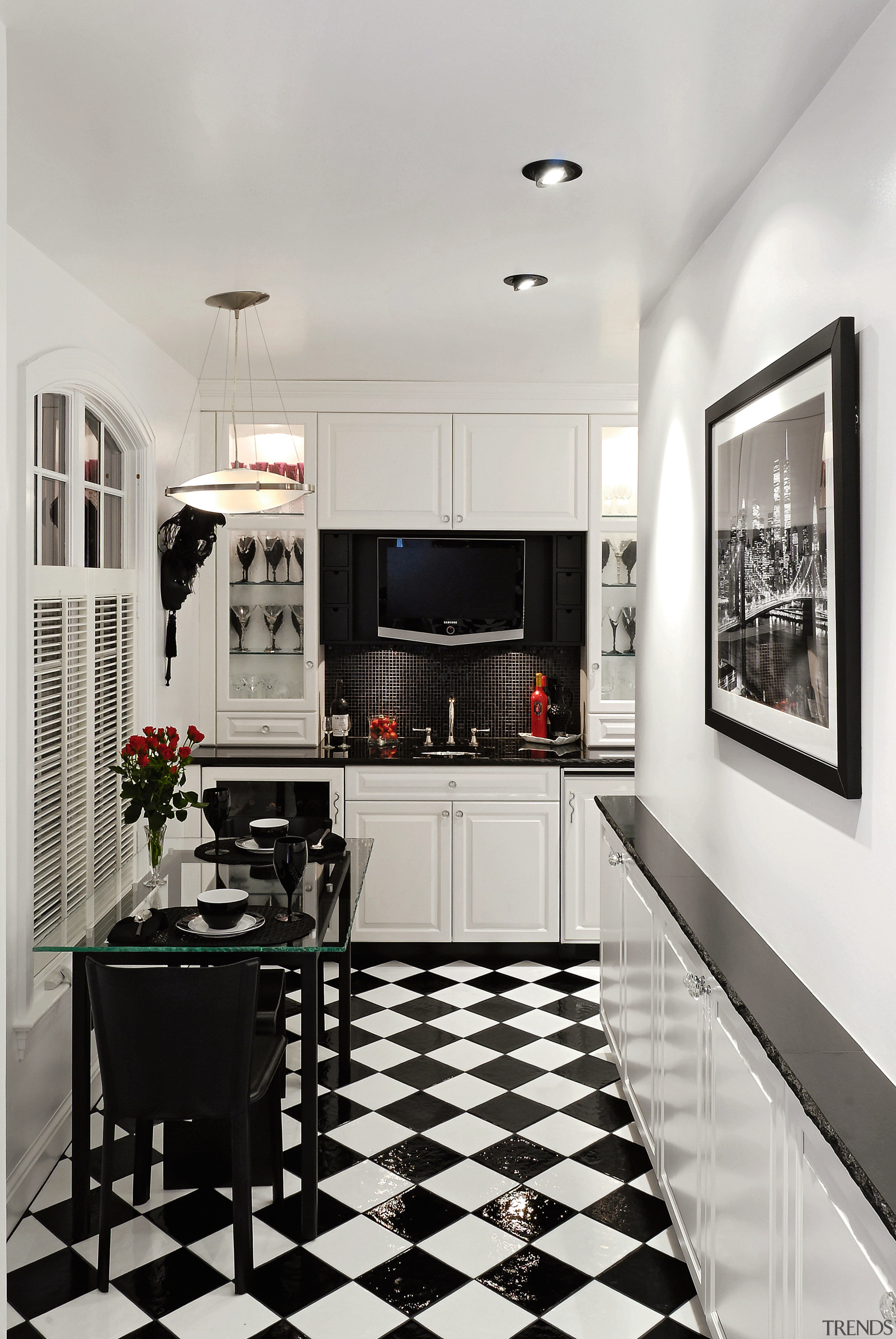 A view of this kitchen featuring black and countertop, floor, flooring, interior design, kitchen, room, gray