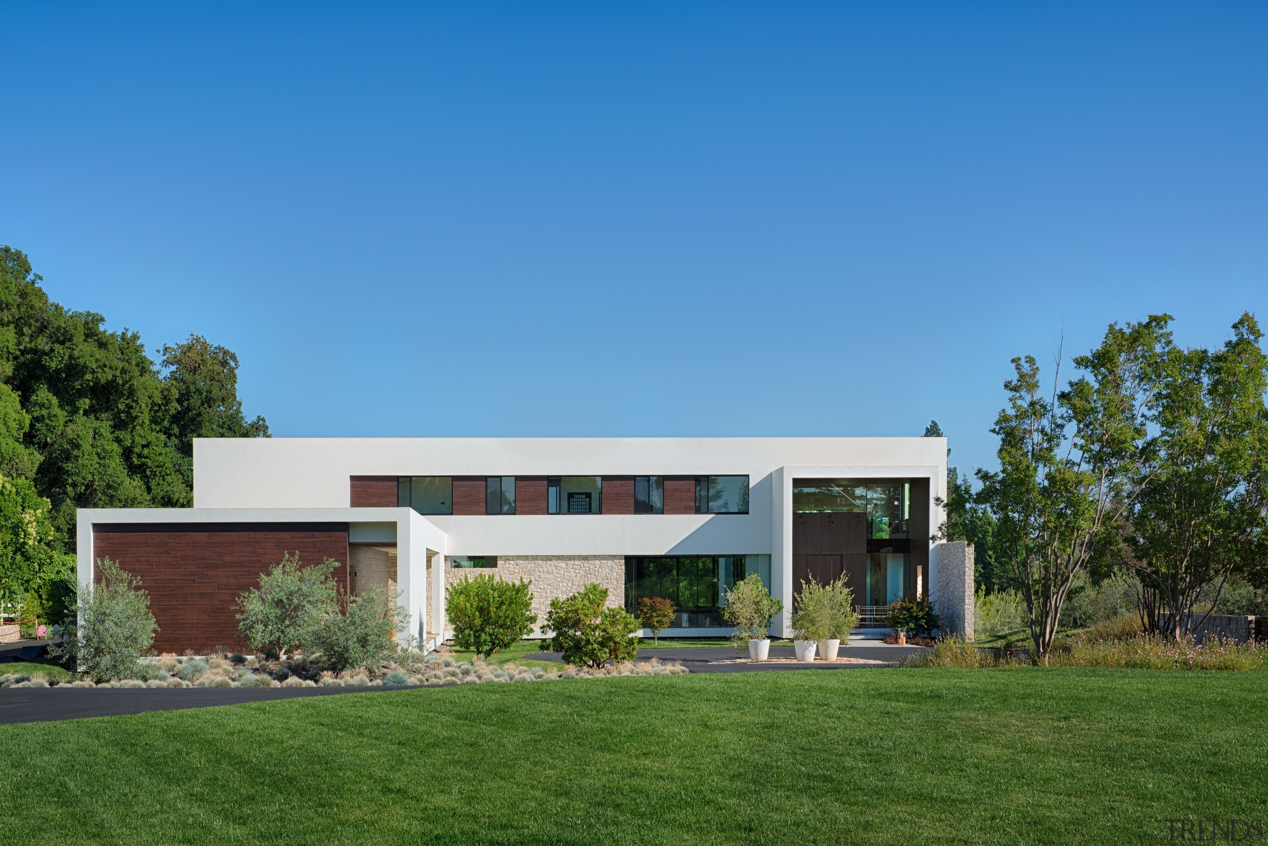 Front facade of new house by architect Mark architecture, corporate headquarters, daytime, elevation, estate, facade, grass, home, house, property, real estate, residential area, sky, teal