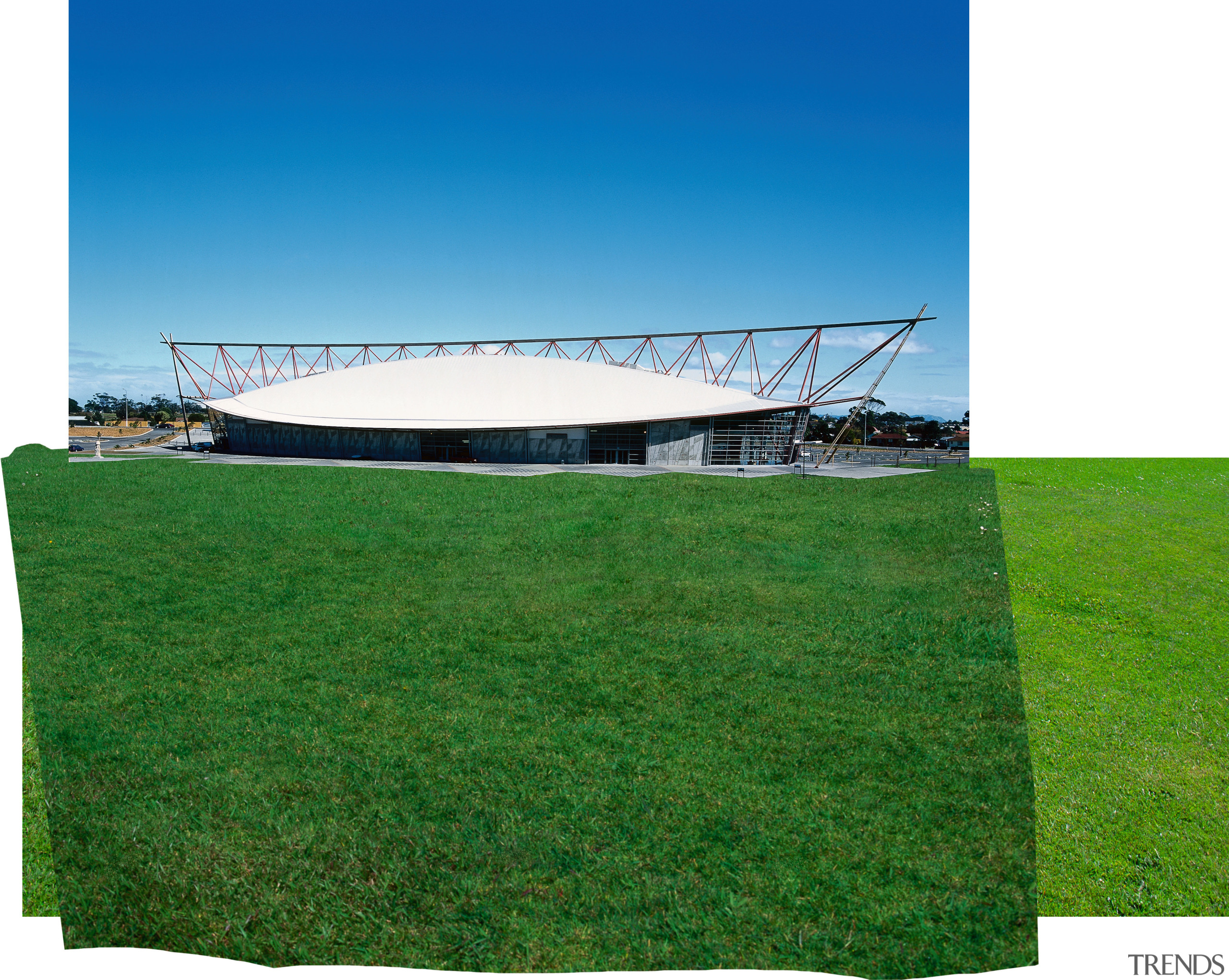 An verall view of the long boat shaped architecture, energy, field, grass, grassland, land lot, lawn, meadow, plant, shade, sky, structure, green