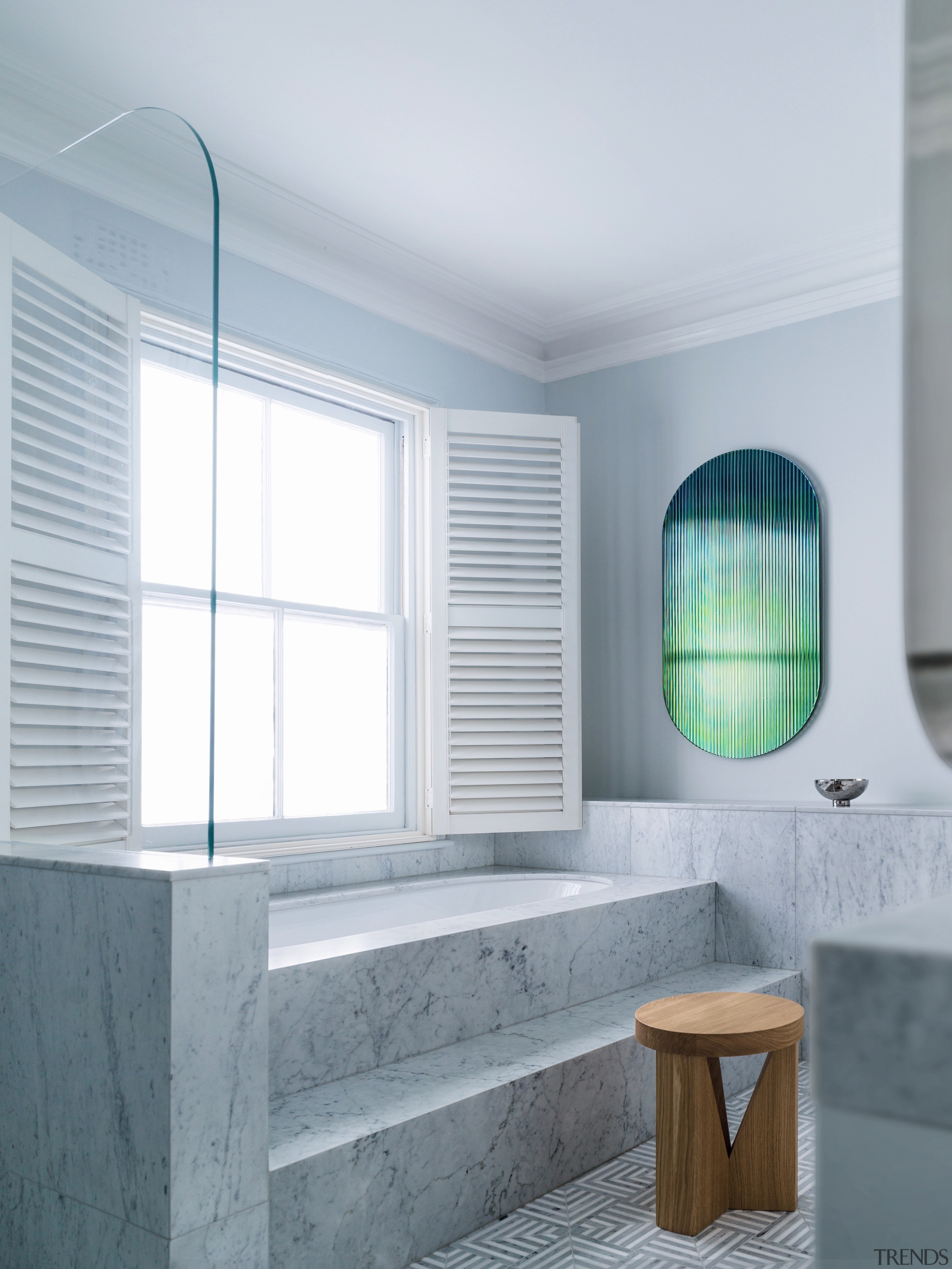 A step-up bath looks out onto the clouds. 