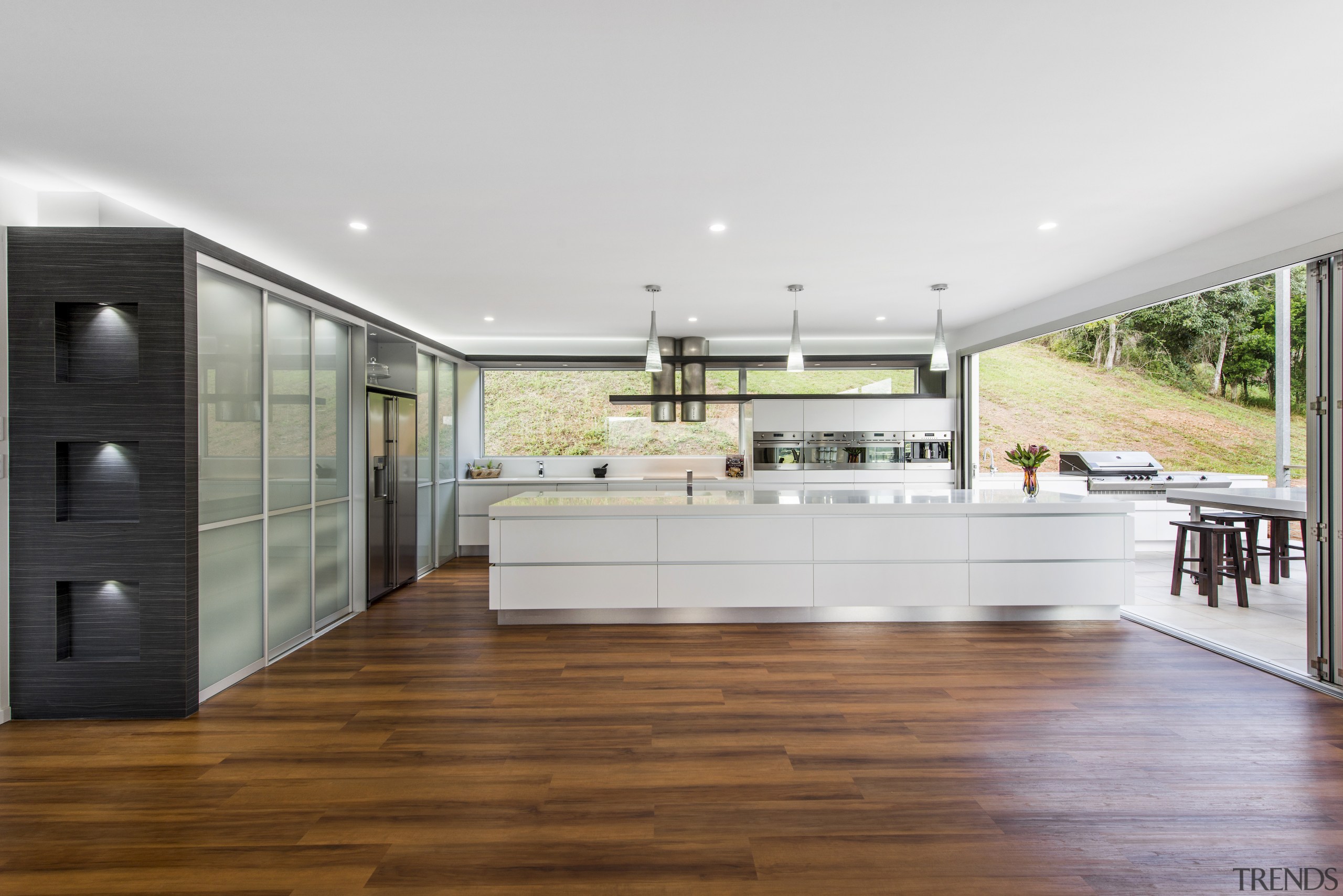 Sleek contemporary kitchen with Smeg appliances - Sleek countertop, floor, flooring, hardwood, house, interior design, kitchen, laminate flooring, real estate, wood flooring, white