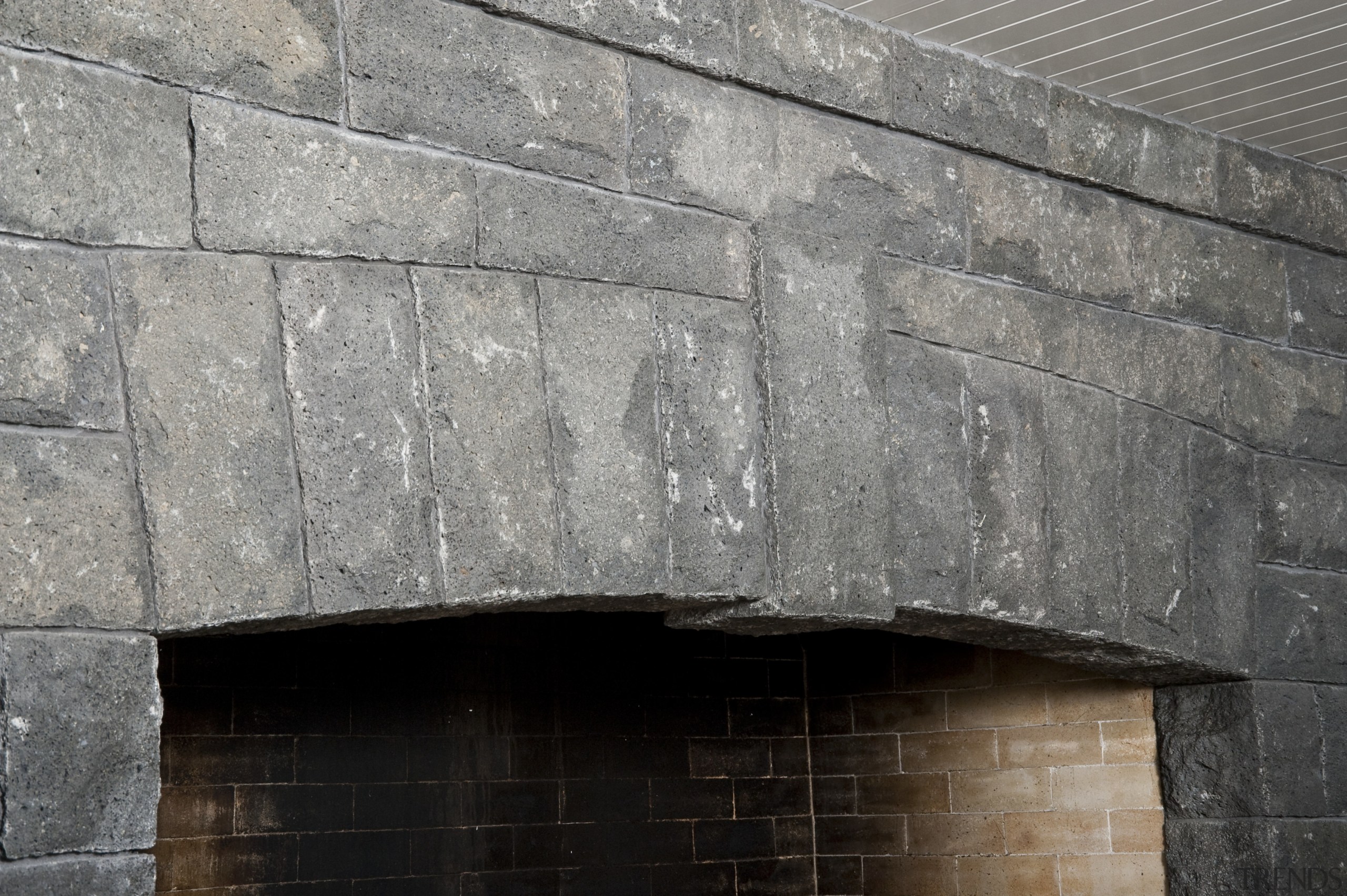 In the dining area of the home this architecture, brick, brickwork, facade, stone wall, wall, gray, black