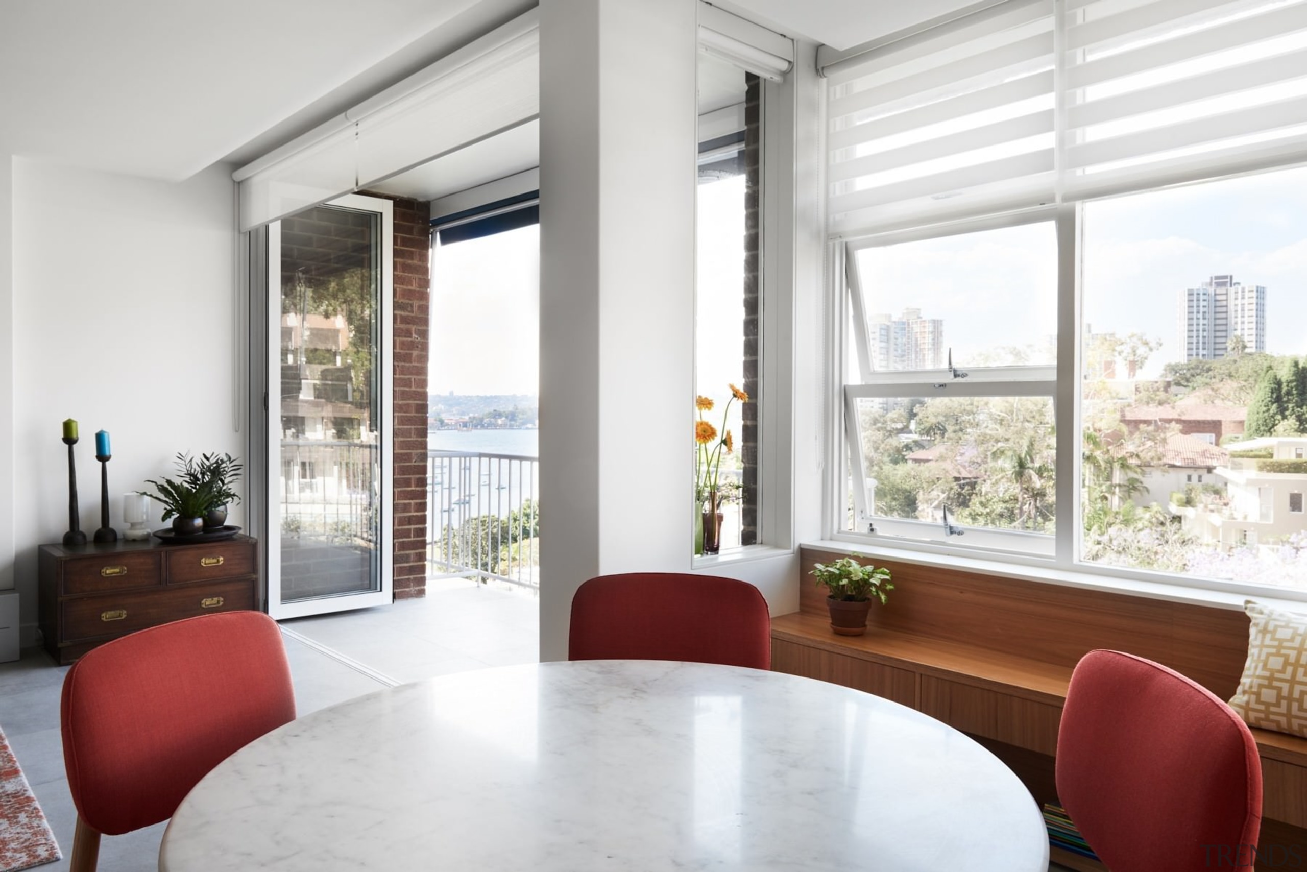 The living room has views out to the apartment, daylighting, house, interior design, living room, property, real estate, window, window covering, window treatment, white