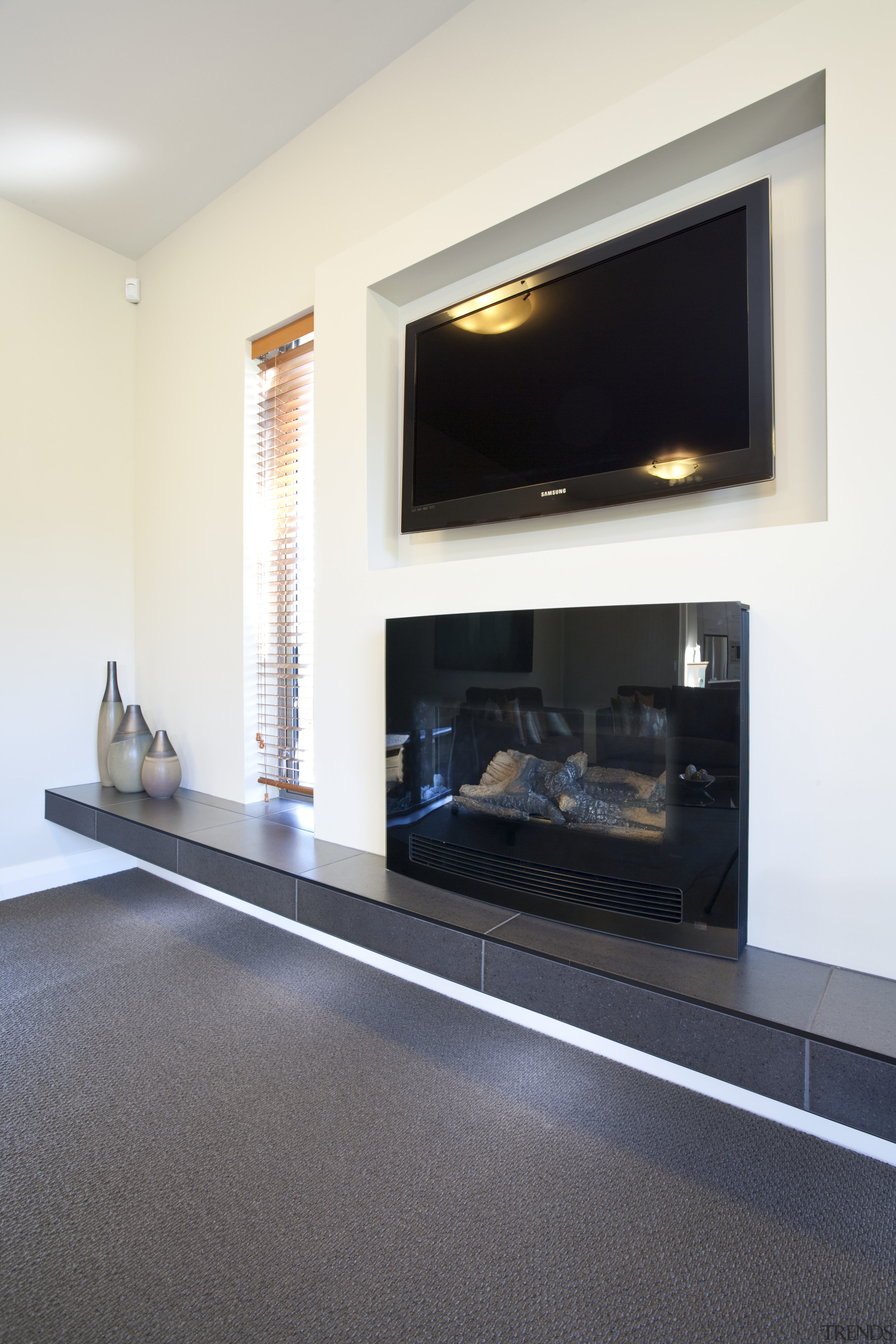 Interior view of David Reid show home living fireplace, floor, flooring, hearth, interior design, living room, room, white, gray