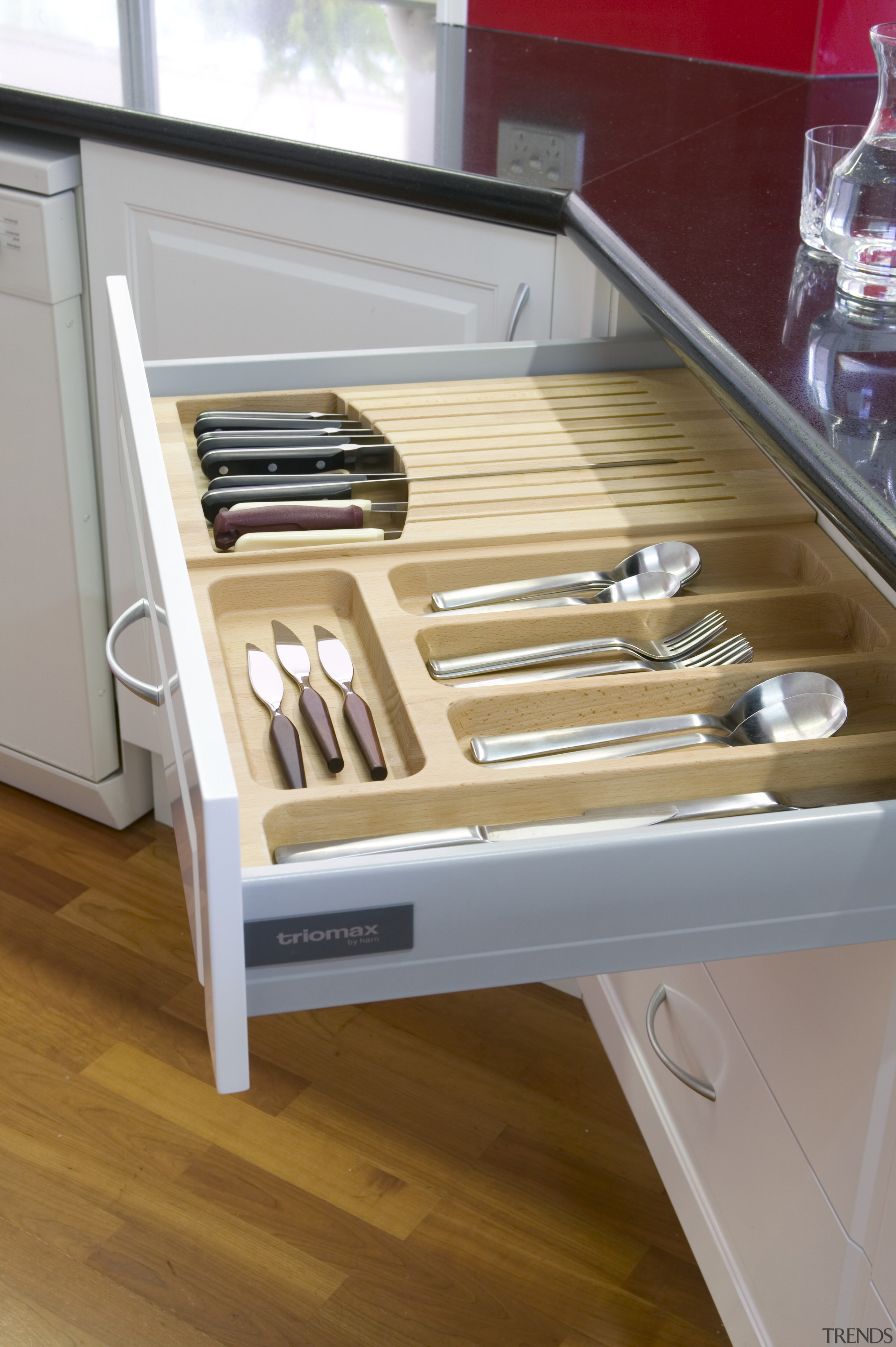 A view of a drawer system by Harn. countertop, drawer, floor, furniture, hardwood, kitchen, product, product design, table, wood, wood stain, gray, brown